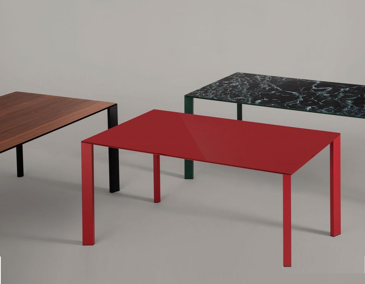 Indoor and outdoor dining table with lacquered metal structure. Glass top with 1/4 inch. thickness. 
Priced in pictured martials:
Cherry red lacquered frame with Cat. A cherry painted glass top. 
Additional charge for glass Cat. B & C
