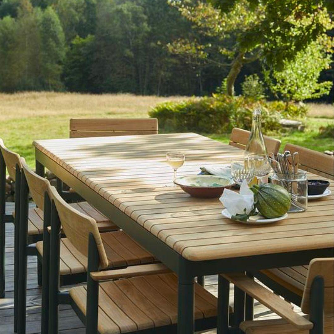 Outdoor 'Pelagus' dining table in teak and hunter green aluminum for Skagerak

Skagerak was founded in 1976 by Jesper and Vibeke Panduro, who took inspiration from their love of Scandinavian design and its rich tradition. The brand emphasizes