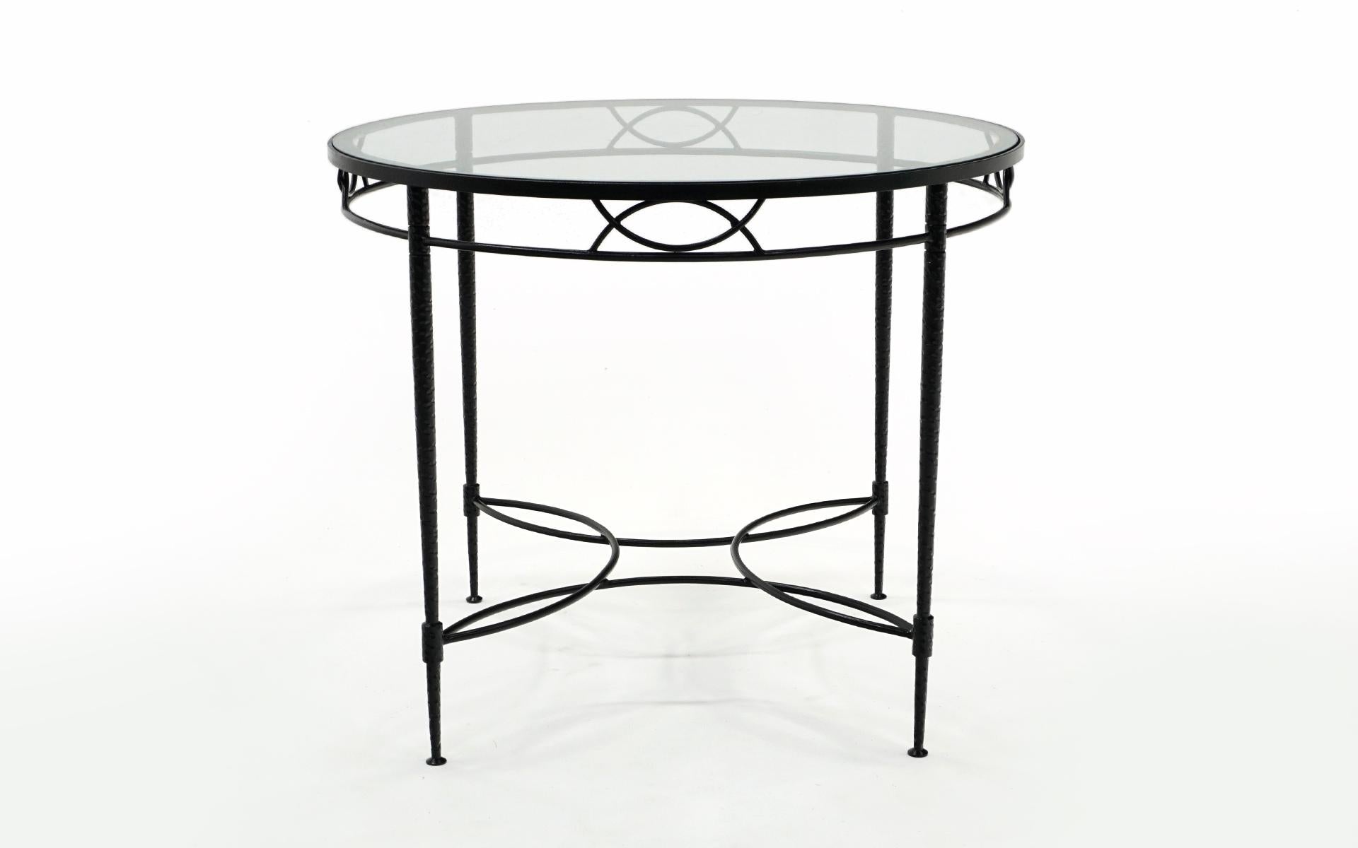 Outdoor / Patio / Pool / dining table designed by Mario Papperzini for John Salterini. Wrought iron and glass. Professonally media blasted and powder coated in a satin black finish. This is hand wrought iron with a distinctive pattern in the iron as