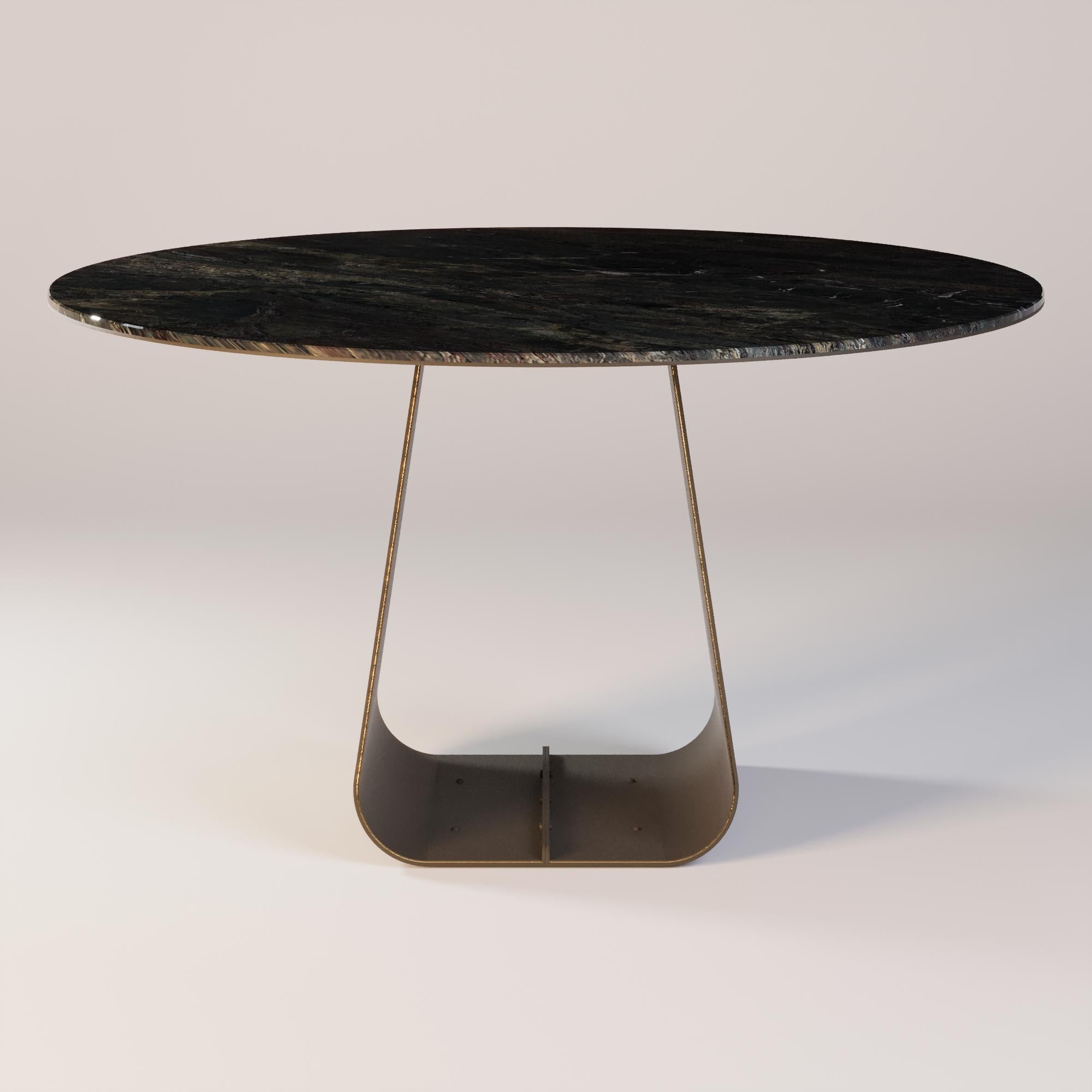 Orizon Round Dining Table 

A dining table where light meets stone and metal. The marble top reveals its unique texture, capturing every nuance of natural light. The round shape invites intimacy, while the legs with subtle metallic details reflect a
