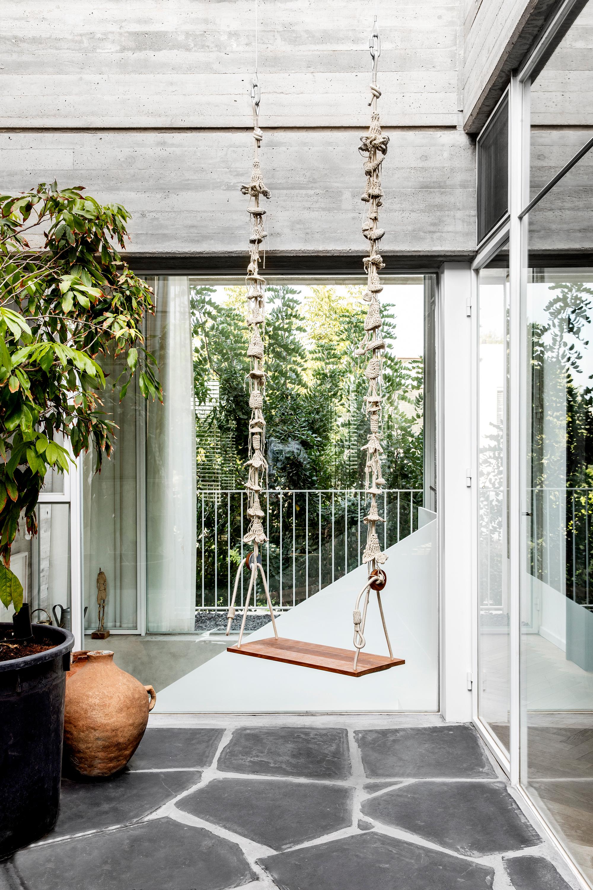 These swings are light, dreamy and perfect for enjoying the outdoors. They are composed of nearly 100 handcrafted elements from a signature UV protected yarn, designed and produced exclusively by iota. The seat of the swing is made of teak