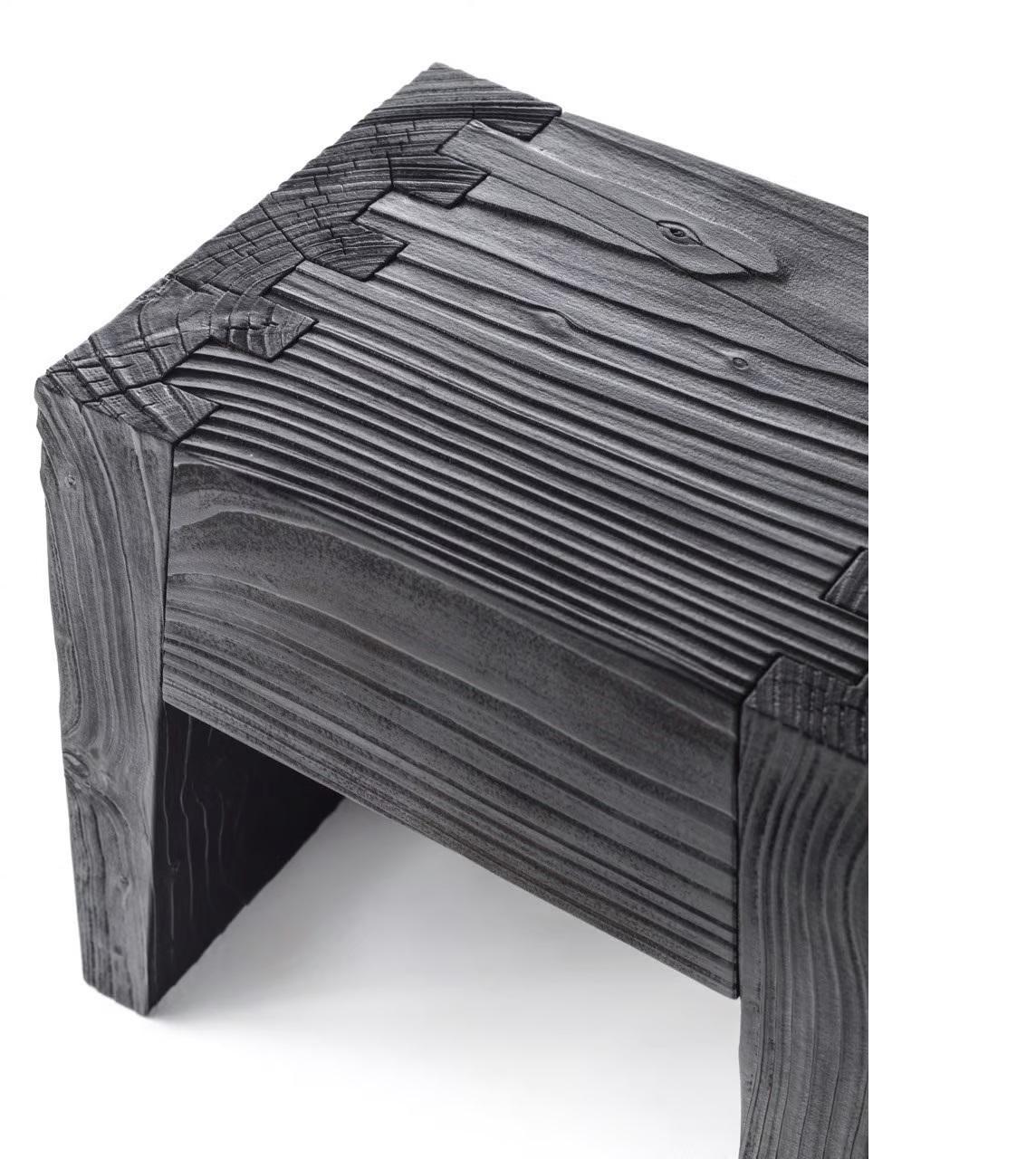 Designed by renowned designer Marc Sadler, the Low Cedarwood Stool is a minimalistic yet bold piece that showcases the natural beauty and warmth of cedar wood. Handcrafted from solid cedar, this stool embraces its raw, organic qualities, with