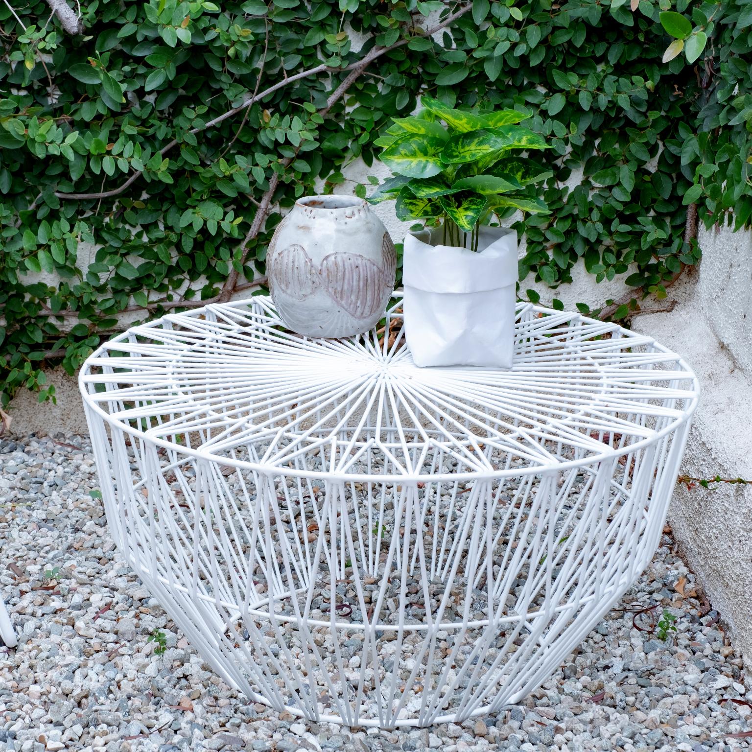 Bend Goods Wire Furniture
The Drum table is a multifunctional wire table or ottoman with an intricate wire pattern and a lightweight round design. This fun versatile piece enhances any indoor or outdoor space. Try a bold color option to brighten a