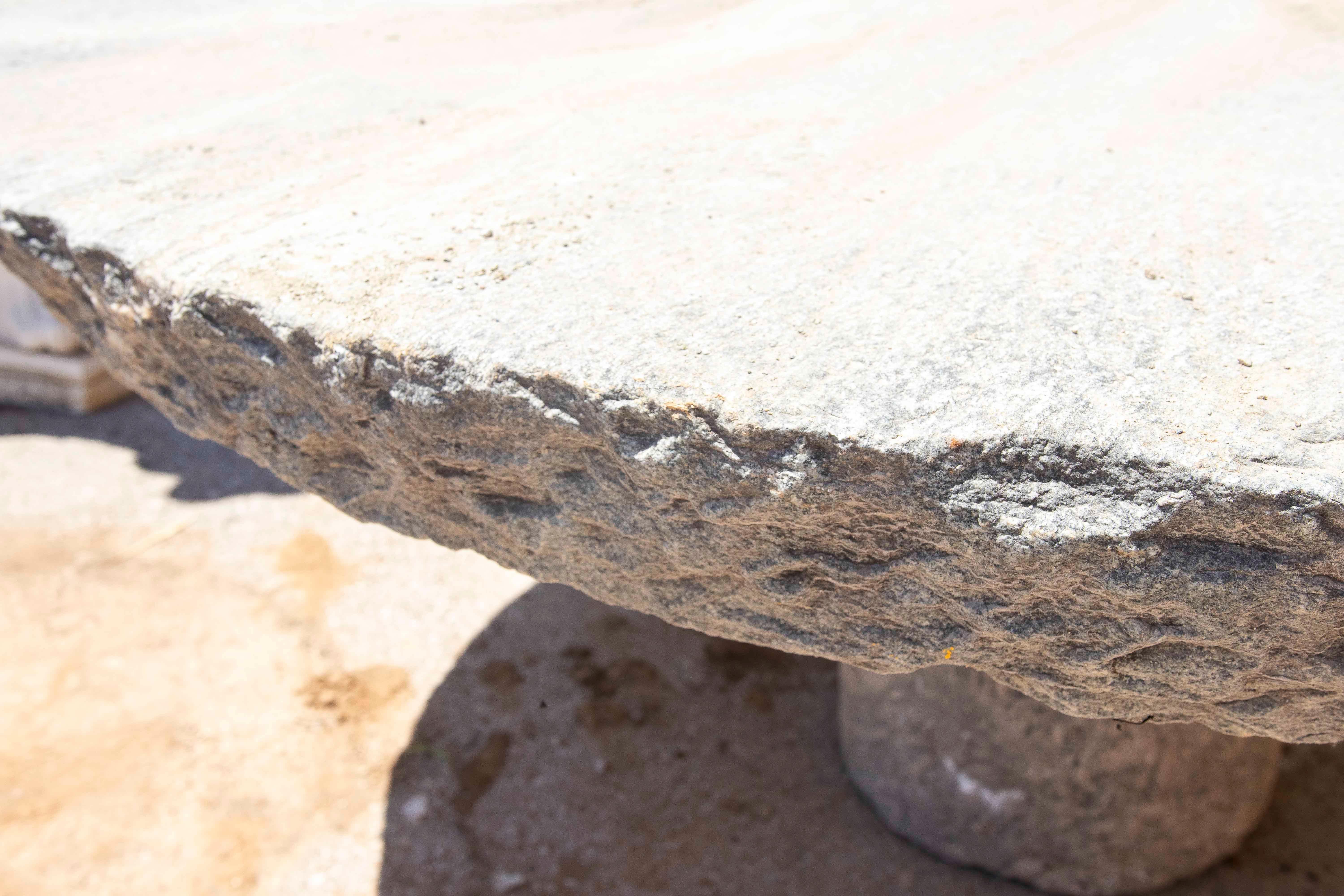 Outdoor Table with Antique Millstone and Cylindrical Base Made of Natural Stone For Sale 7