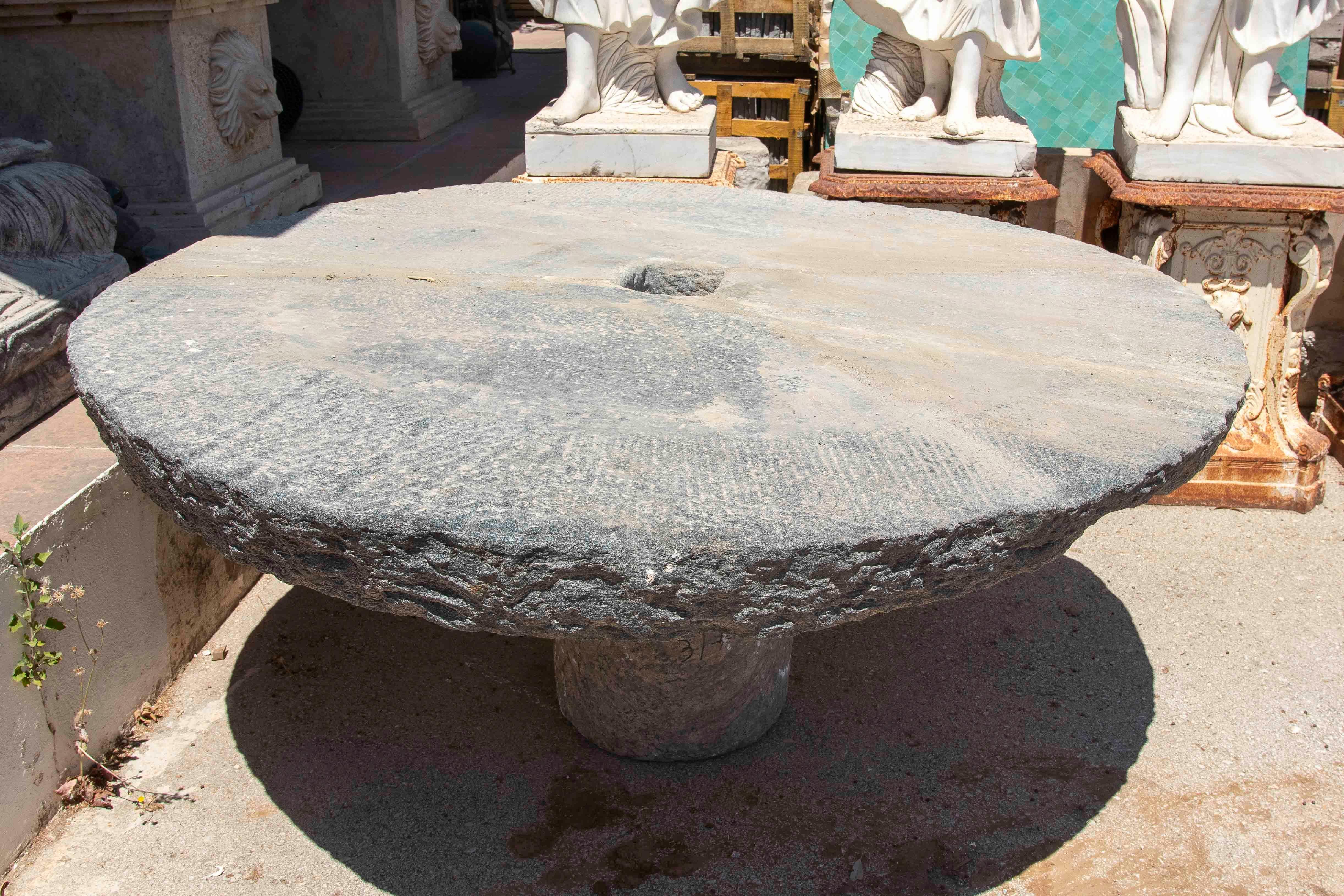20th Century Outdoor Table with Antique Millstone and Cylindrical Base Made of Natural Stone For Sale