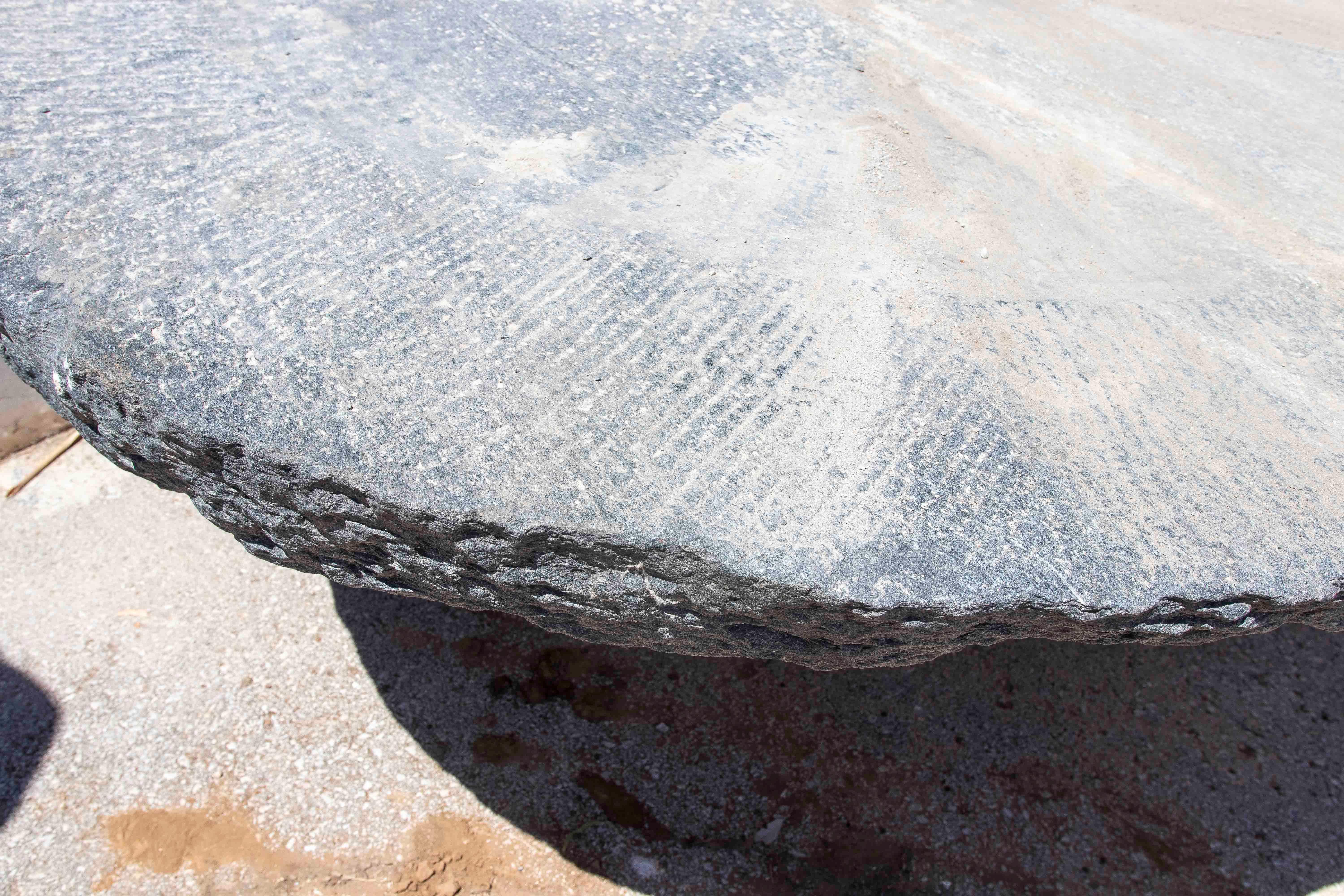 Outdoor Table with Antique Millstone and Cylindrical Base Made of Natural Stone For Sale 1