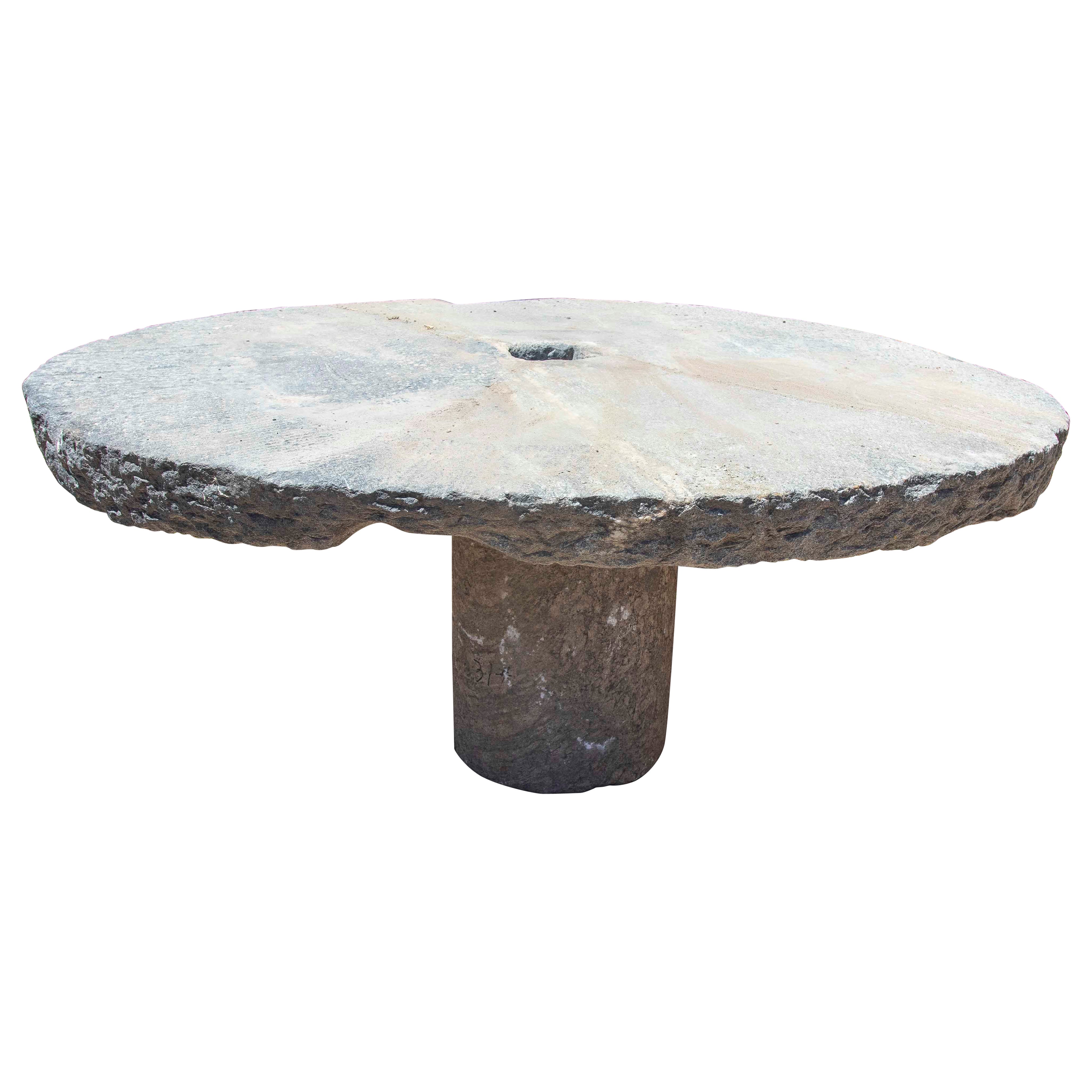 Outdoor Table with Antique Millstone and Cylindrical Base Made of Natural Stone For Sale