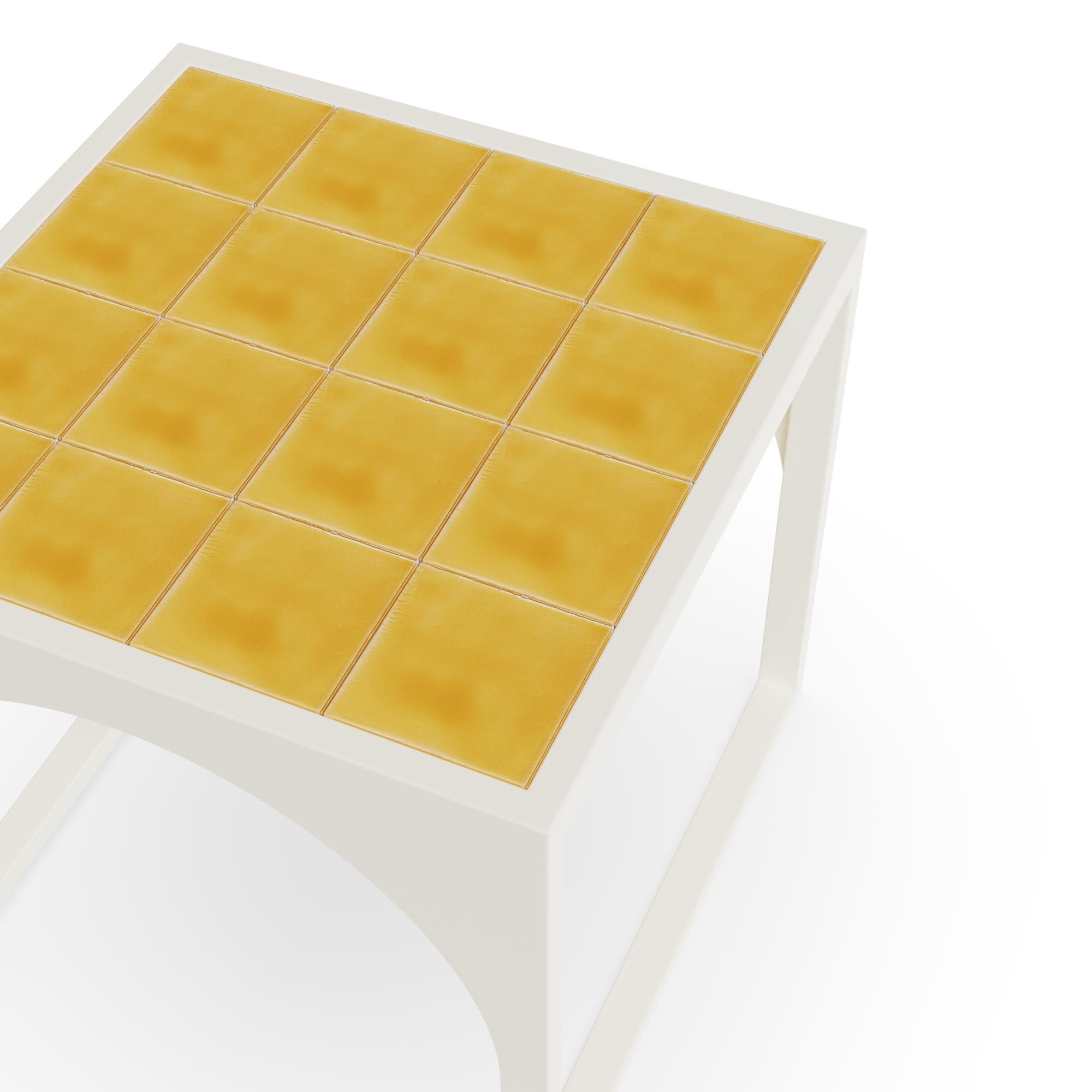 The Tosalet Side Table, created in partnership with Mediterrazza, captures the essence of Mediterranean elegance with its clean architectural lines and refined details. Handcrafted for durability, this piece combines a vibrant glazed ceramic top