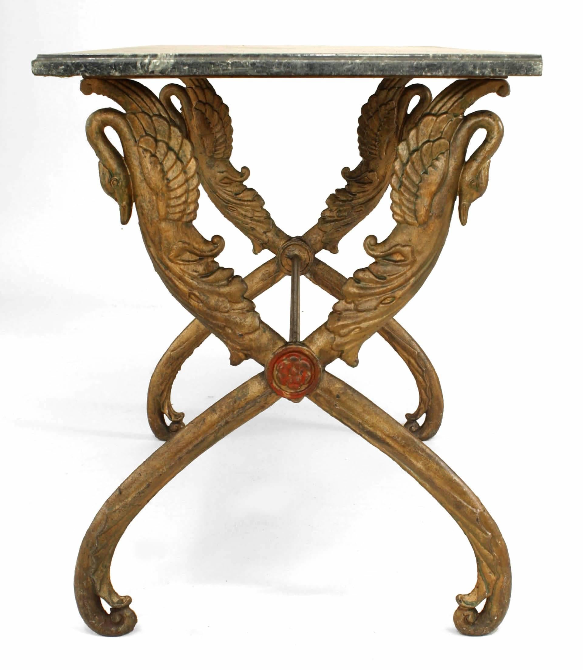 Outdoor Victorian (late 19th/20th Century) painted iron center table with rectangular black marble top on two X form swan headed legs.
