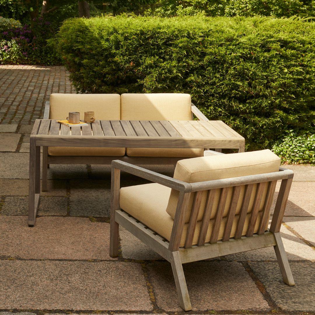 Outdoor 'Virkelyst' 2-seater sofa in teak and honey yellow fabric for Skagerak

Skagerak was founded in 1976 by Jesper and Vibeke Panduro, who took inspiration from their love of Scandinavian design and its rich tradition. The brand emphasizes