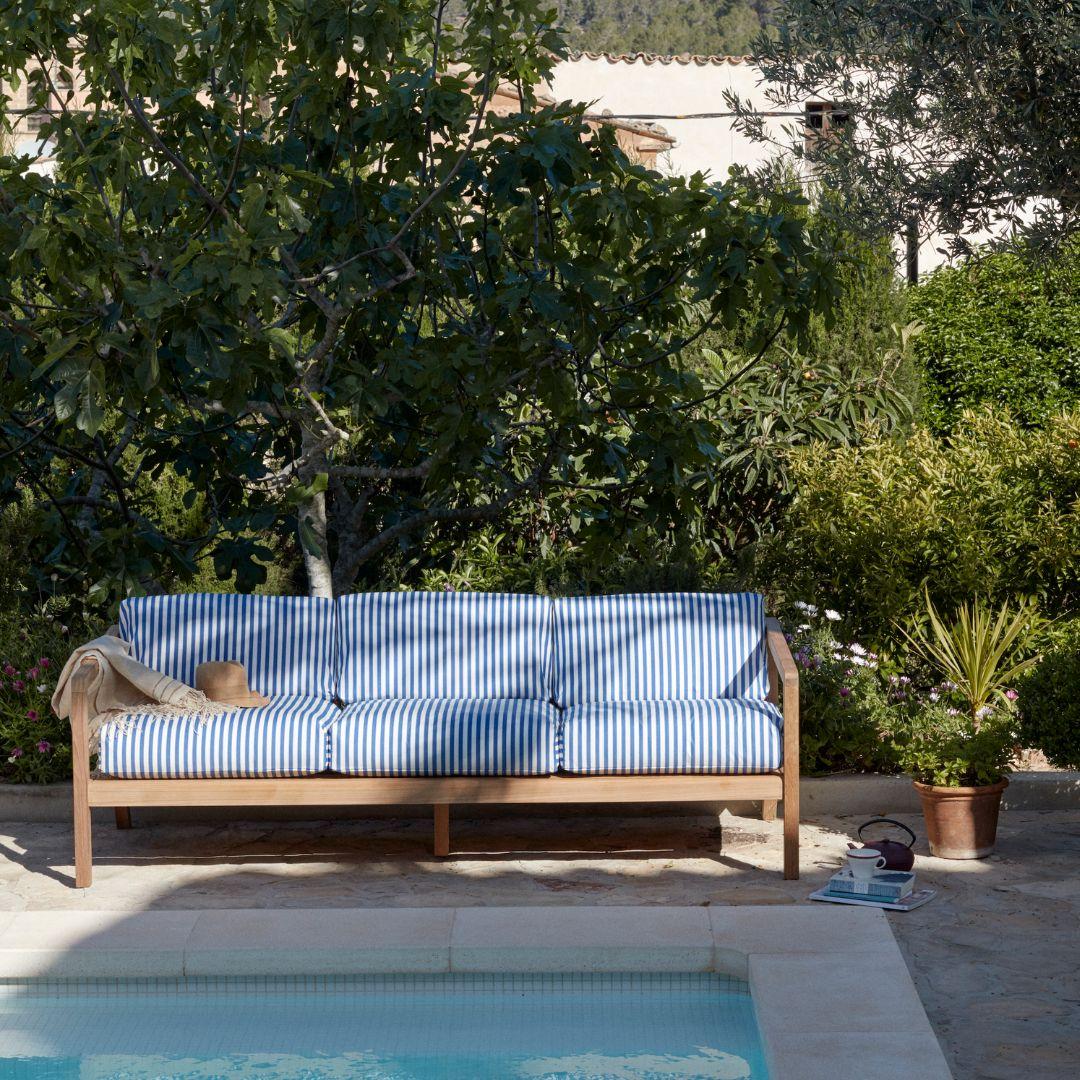 Outdoor 'Virkelyst' 3-seater sofa in teak and blue striped fabric for Skagerak

Skagerak was founded in 1976 by Jesper and Vibeke Panduro, who took inspiration from their love of Scandinavian design and its rich tradition. The brand emphasizes