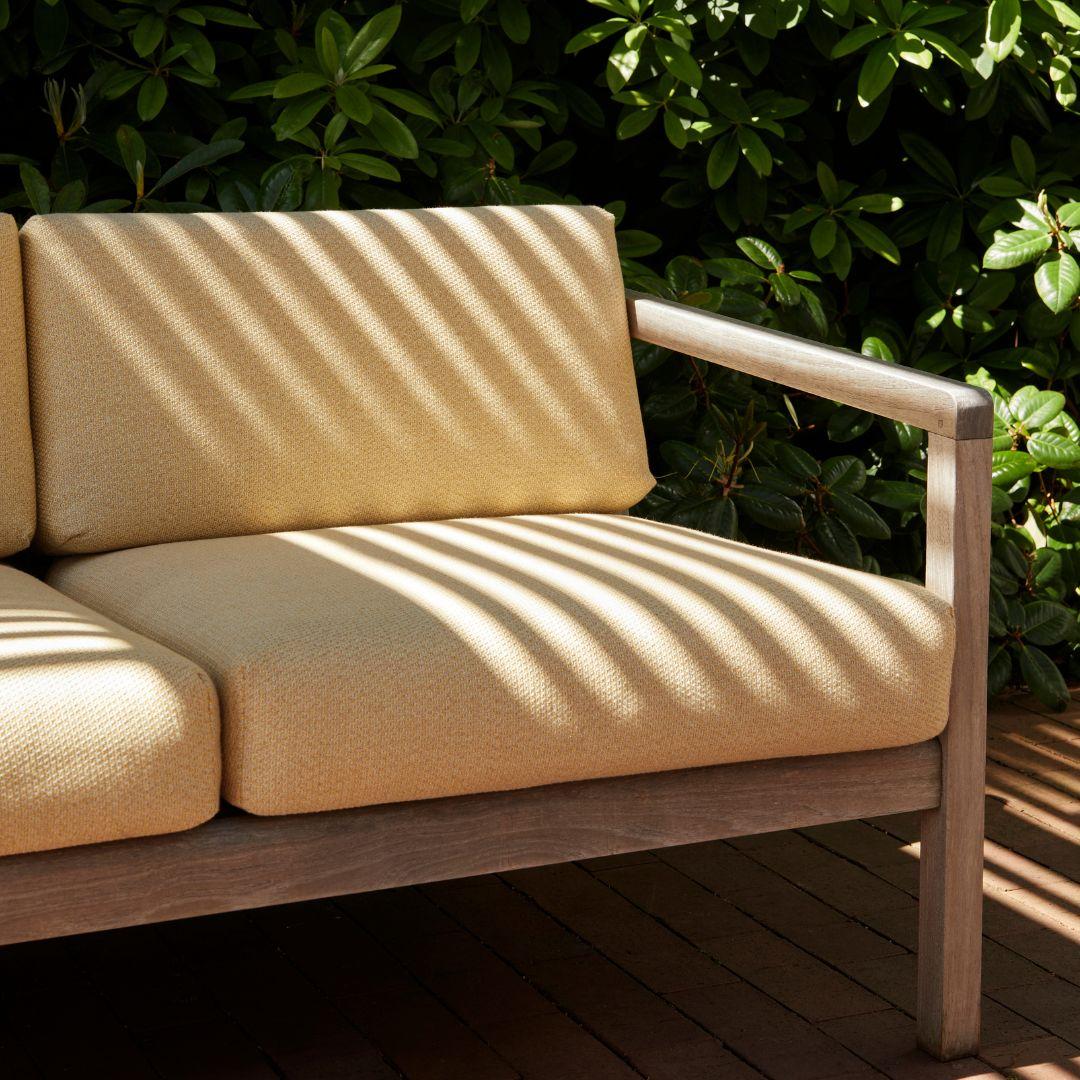 Outdoor 'Virkelyst' 3-seater sofa in teak and honey yellow fabric for Skagerak

Skagerak was founded in 1976 by Jesper and Vibeke Panduro, who took inspiration from their love of Scandinavian design and its rich tradition. The brand emphasizes