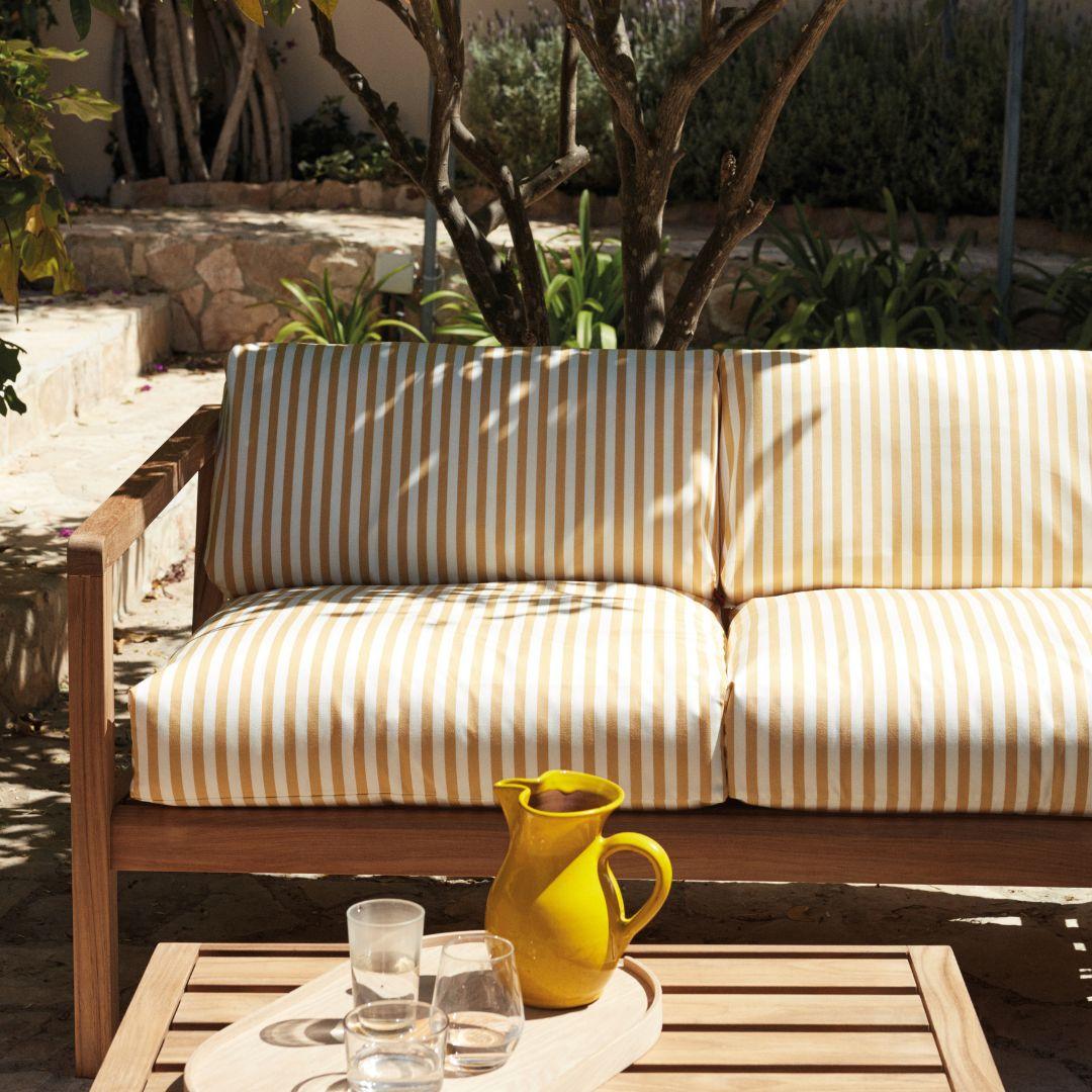 Outdoor 'Virkelyst' 3-seater sofa in teak and yellow striped fabric for Skagerak

Skagerak was founded in 1976 by Jesper and Vibeke Panduro, who took inspiration from their love of Scandinavian design and its rich tradition. The brand emphasizes