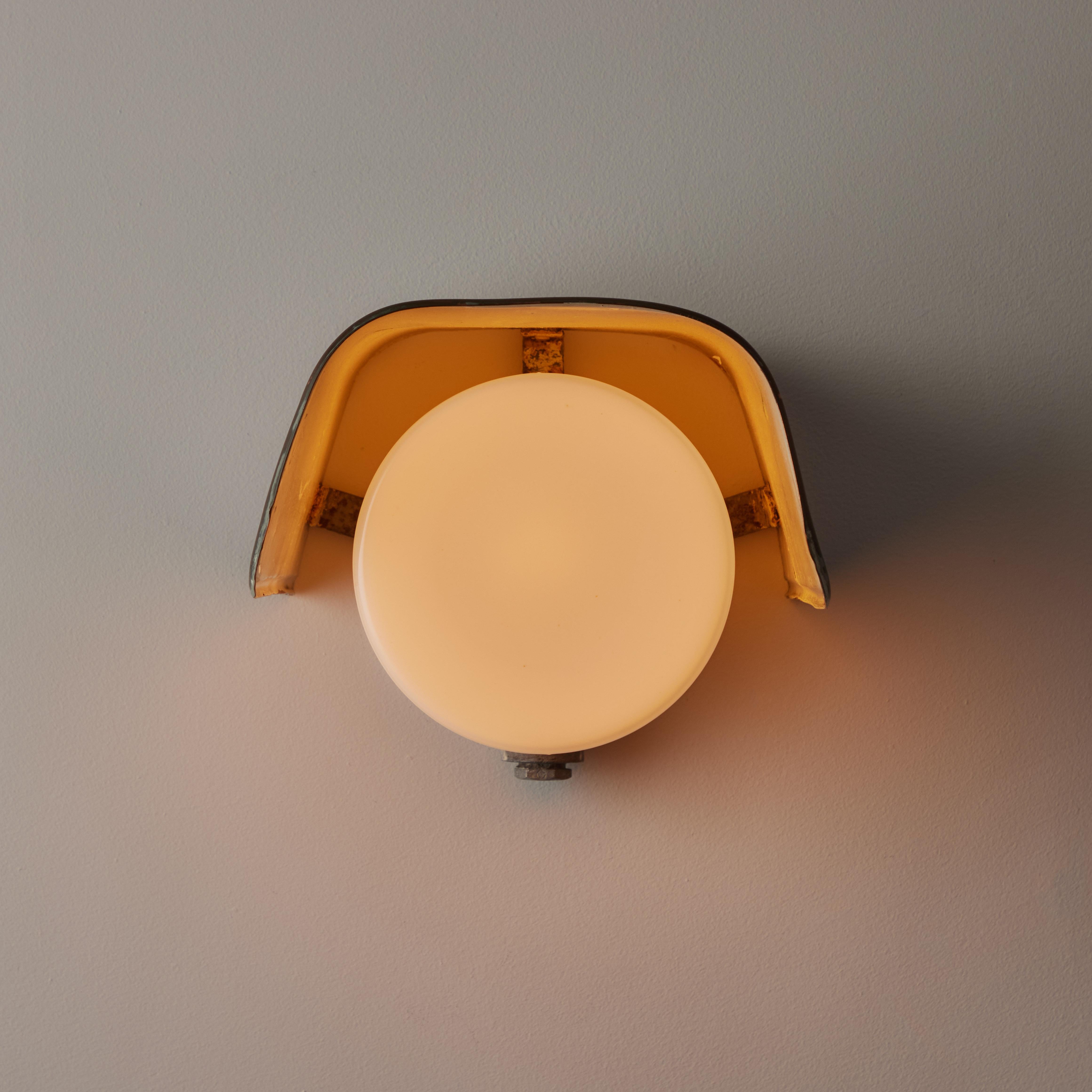 An Outdoor wall light by Paavo Tynell for Tato Oy. Designed and manufactured in Finland, circa 1950's. Copper, glass. Rewired for U.S. standards. We recommend one E26 60W maximum bulb. Bulb is not included. Only one single is available.