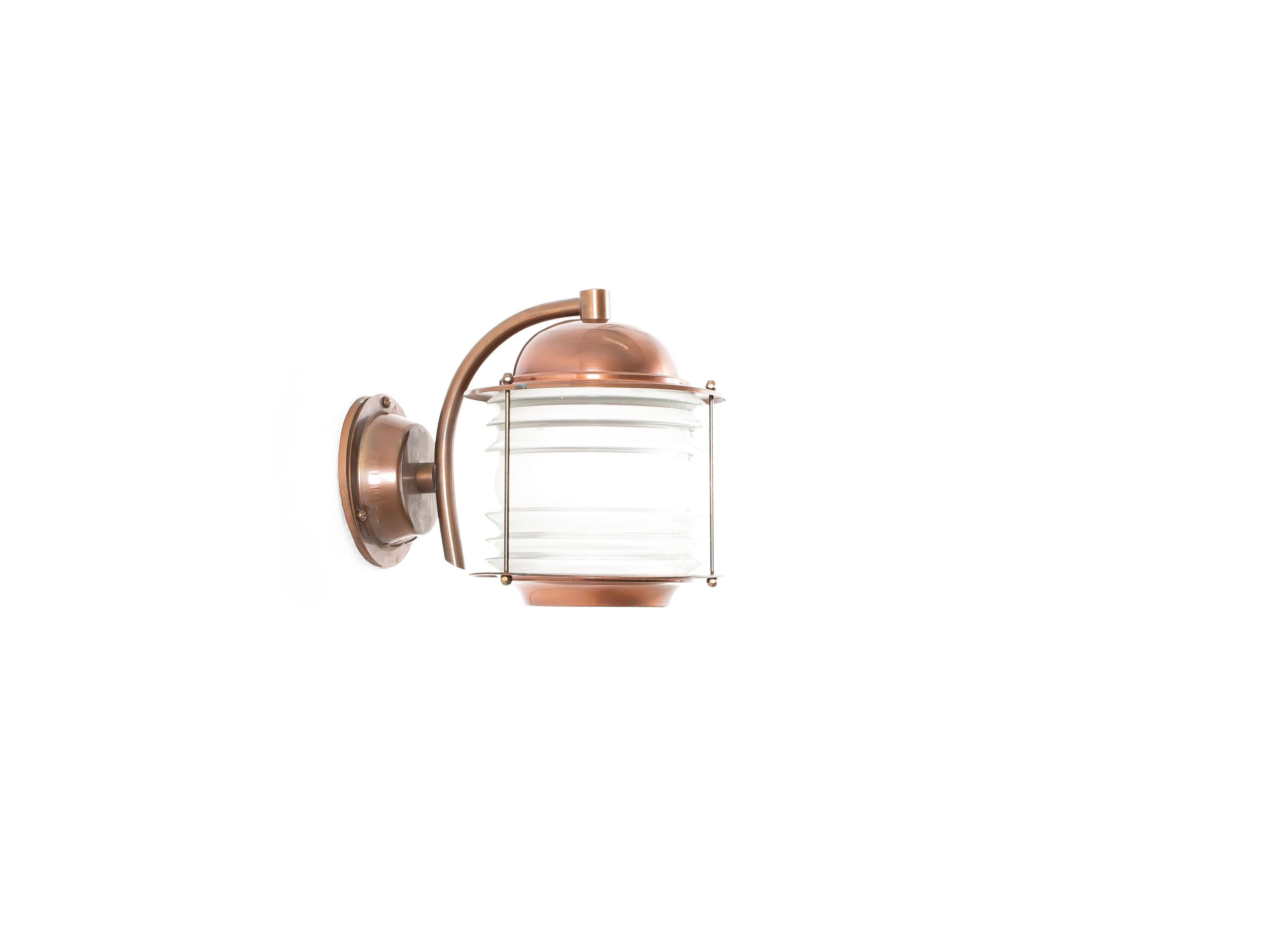Sculptural wall light in copper and glass. Designed and made in Norway from circa 1970s first half. The lamp is fully working and in good vintage condition. The lamp is fitted with one E27 bulb holder (works in the US) with a recommended max wattage