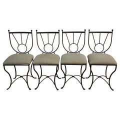 Ensemble de quatre chaises d'extérieur en fer forgé de style Mario Papperzini