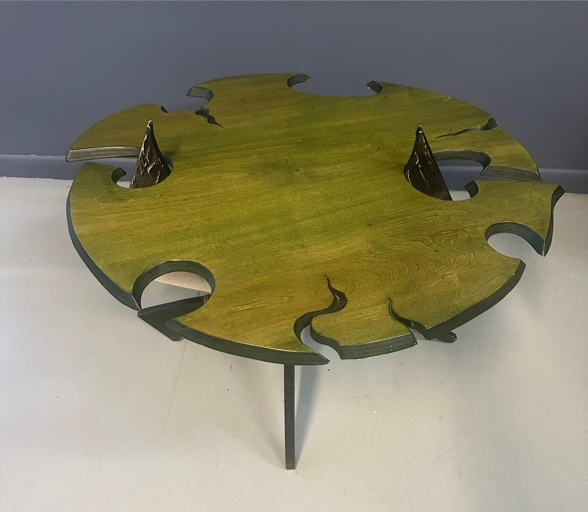 As a handcrafted coffee table, this unique piece infuses Asian flair into any space. The outsider artist’s intricate design reflects cultural motifs and expert craftsmanship. Made with only high-quality materials the serpentine top with green dye is