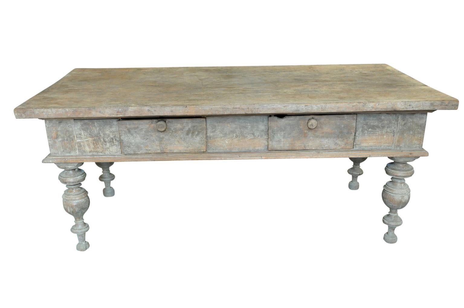 An outstanding 17th century Reflectoire Table from Northern Italy. Soundly constructed from walnut with very handsome turned legs, a very thick top plank and two drawers. Wonderful patina and tone. A tremendous piece to serve as a grand sofa table