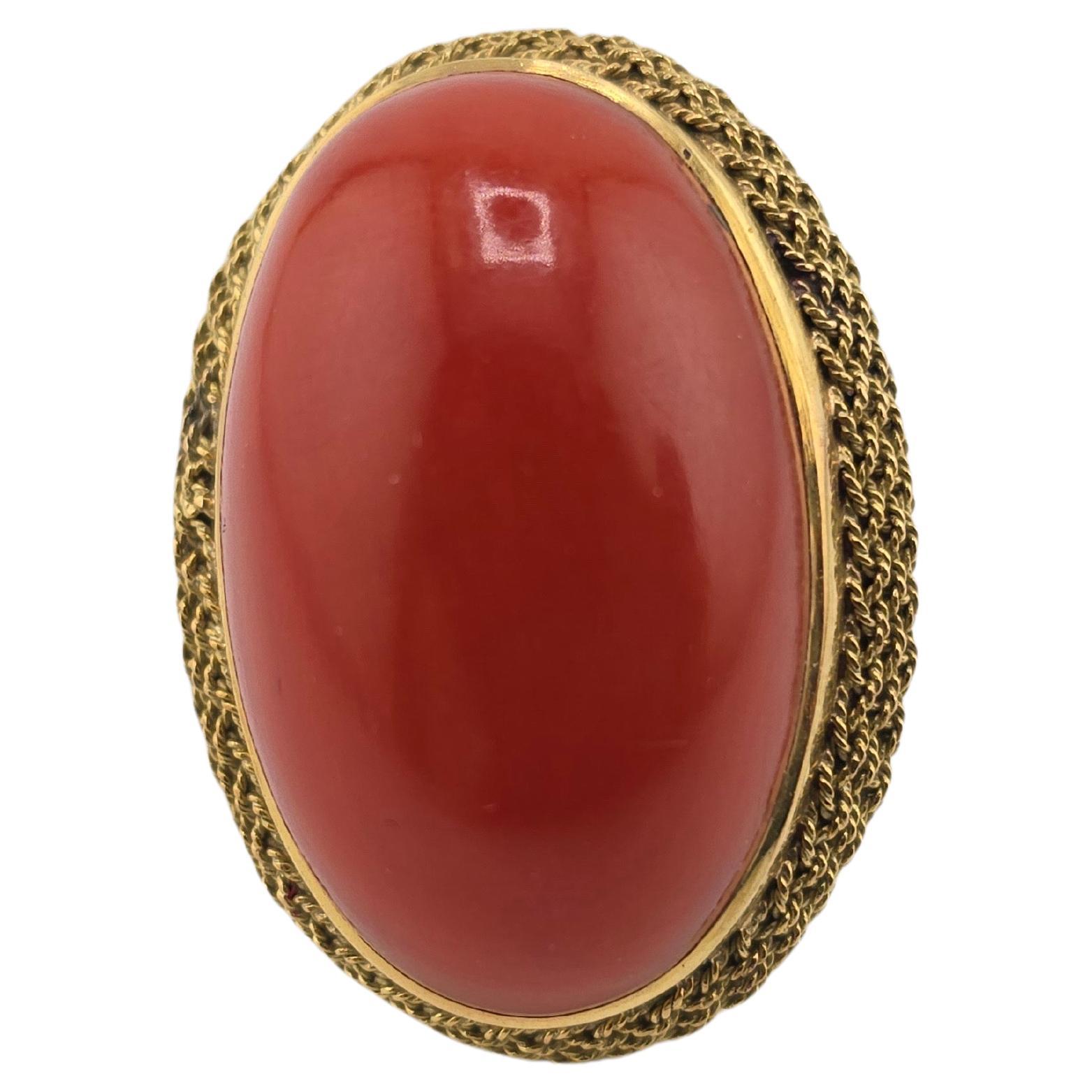 This is a massive gorgeous, deep red coral ring, made with 18 karat solid yellow gold. The redness on the coral is just indescribable and can only be seen in person to truly understand the deep redness of the color. Coral is mainly valued by the