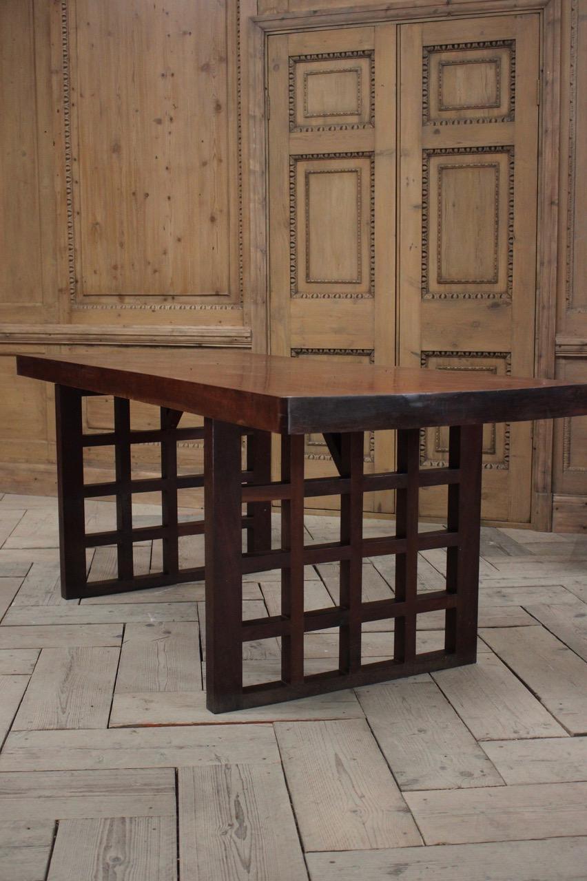 A good quality, circa 1930s Glasgow School Arts & Crafts dining table / desk. The top made of a single piece of teak. Very unusual as per the thickness of it. It is very possible that the top would be 19th century with a later 1930s base.

This