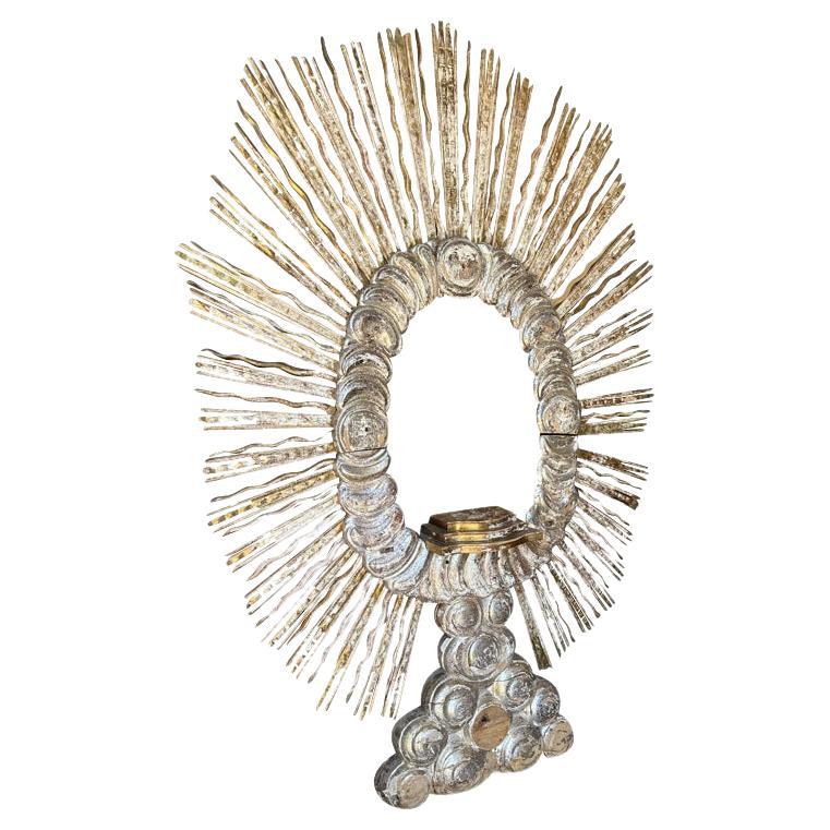An outstanding and grand scale 18th century Sunburst from Verona, Italy.  Exquisitely crafted from gold and silver gilt wood.  The altar shelf and back foot are removable.  Whether freestanding or wall mounted, this Sunburst is indeed a magnificent