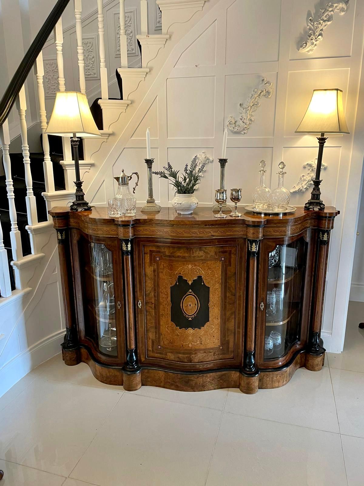 Outstanding quality antique Victorian burr walnut marquetry inlaid serpentine shaped credenza having a superior quality burr walnut serpentine shaped inlaid and emboyna crossbanded top above an inlaid shaped frieze with ornate brass beading above a
