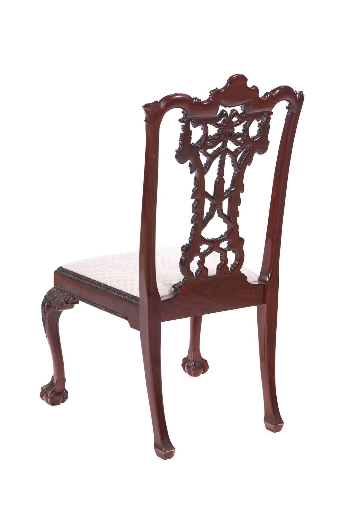 Outstanding antique carved mahogany desk chair, with a fantastic carved ribbon back, open splat centred by tassel, drop in seat, standing on lovely leaf scroll carved cabriole legs with claw and ball feet to the front outswept back legs.