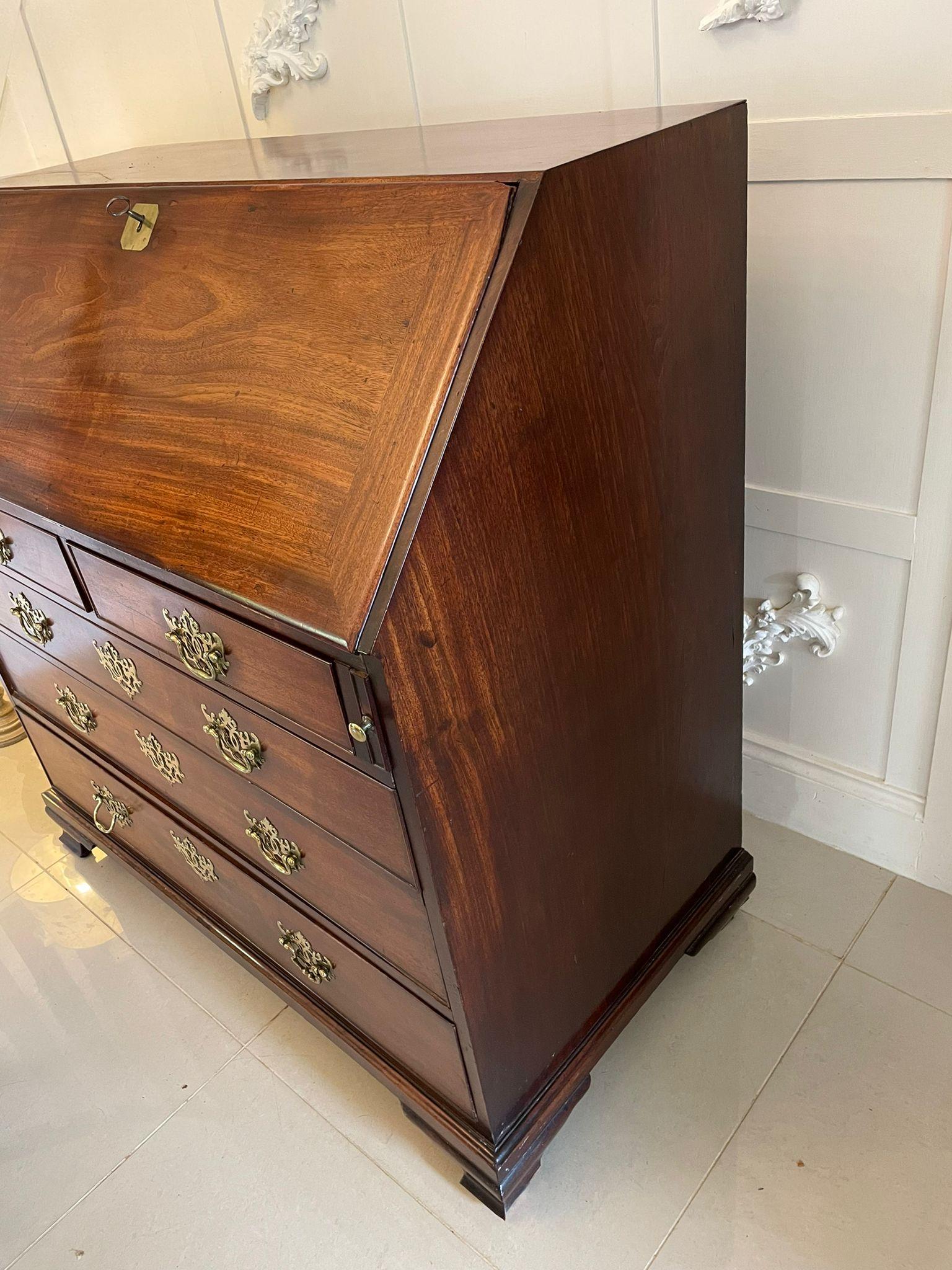 Outstanding antique George III quality mahogany bureau having a quality fall opening to reveal a outstanding fully fitted interior consisting of ten drawers, a door to the centre flanked by drawers, two secret pull out letter compartments above two