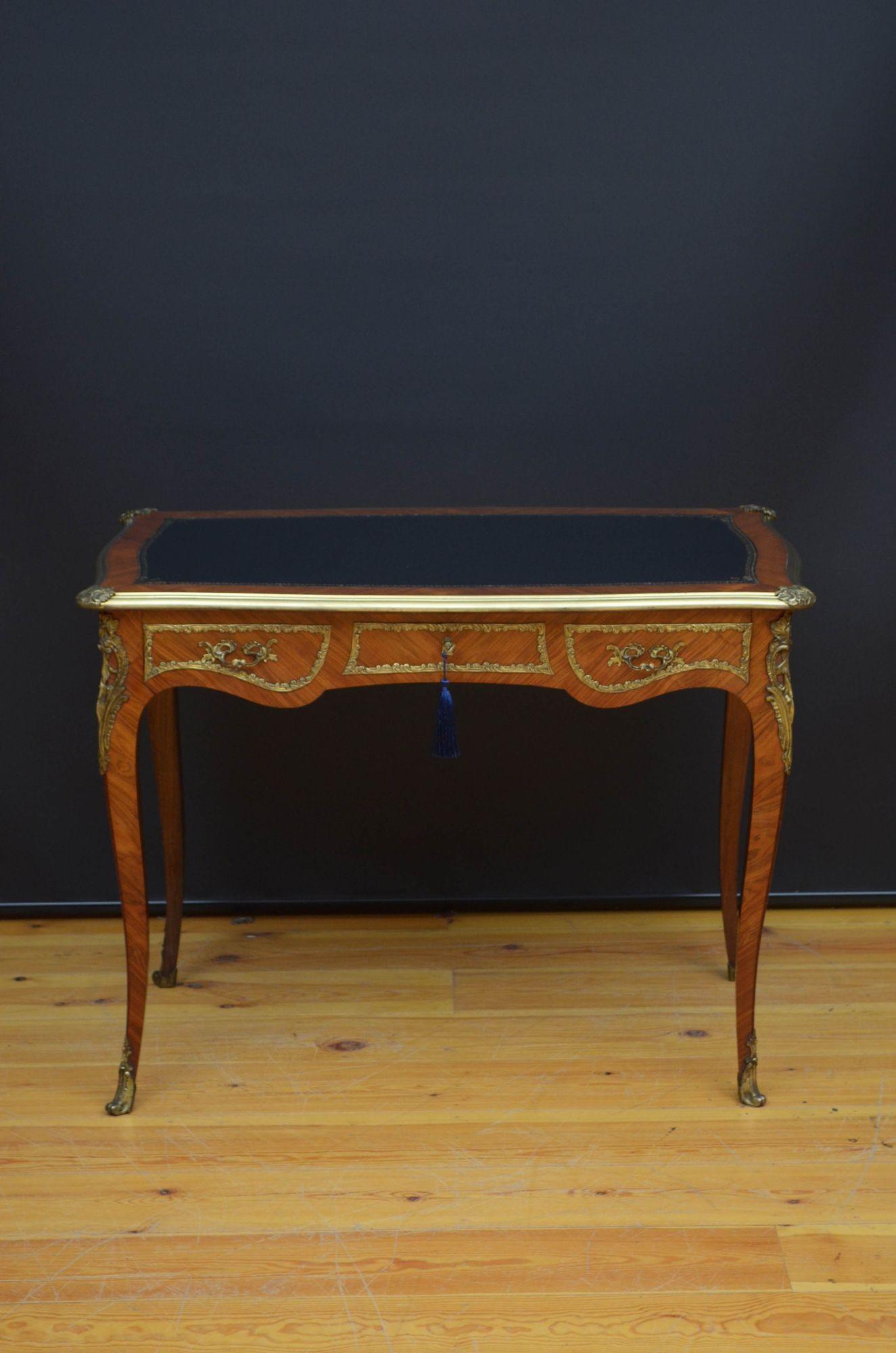 Sn5472 Outstanding 19th century kingwood and ormolu writing desk, having new black tooled leather writing surface, serpentine top with brass moulding to the edge and decorative corners above long frieze drawer fitted with original working lock, key