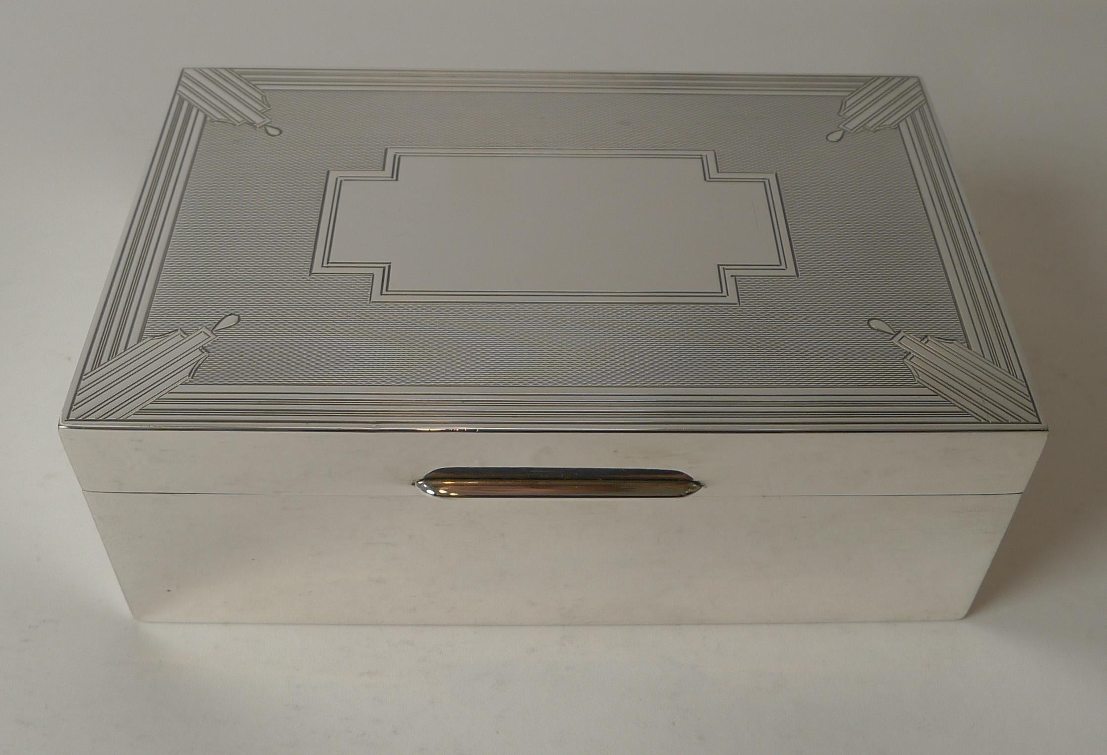 An outstanding and highly decorative box, originally for cigarettes but perfect for a desk box, cufflink or jewellery box or simply to enjoy it's sheer beauty.

The box is made from English sterling silver and is fully hallmarked for London 1934