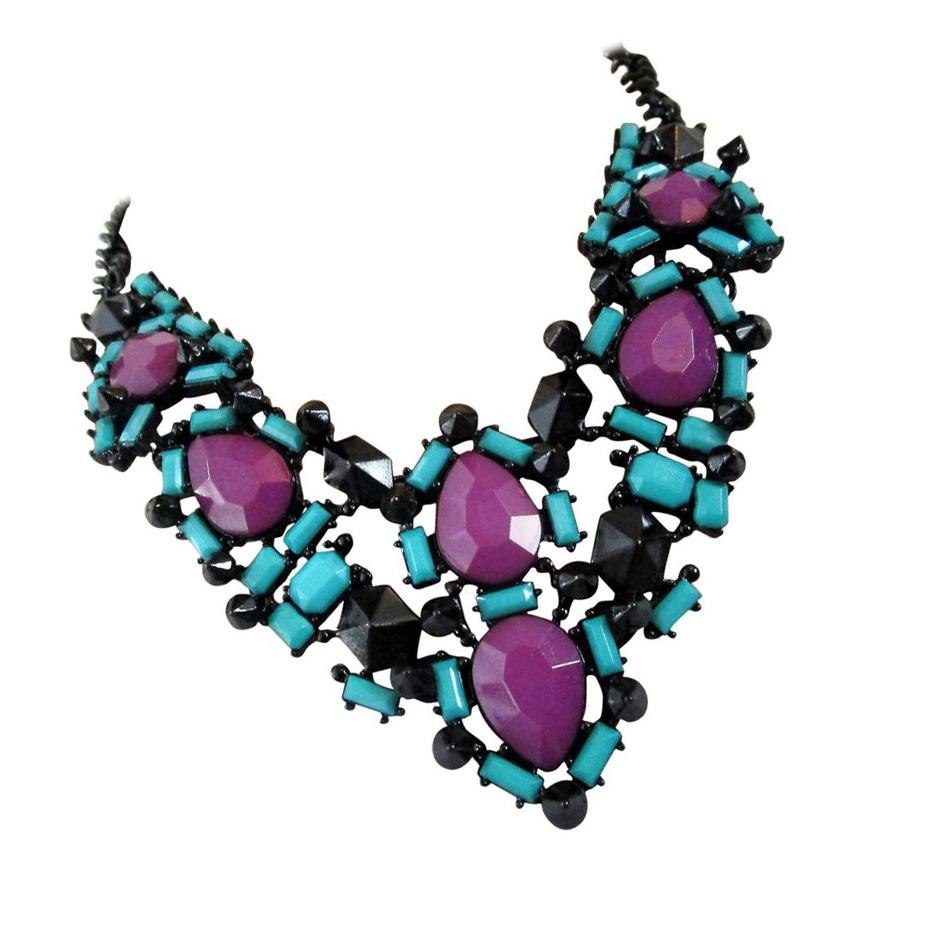 Striking Statement Necklace; rich Blue Teal, Purple and Black Faux Gems set in Black Japanned metal mounting; approx. 19.5 inches long; can be worn shorter with a lobster claw clasp. Chic and Classic…Illuminating your look with Timeless Beauty!

