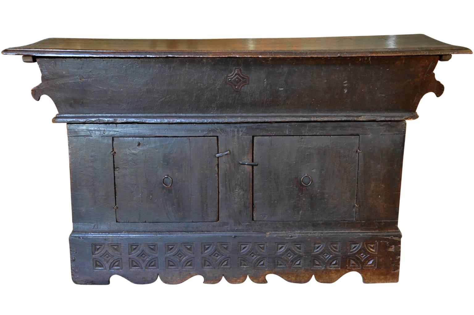 A very rare and outstanding early 18th century Petrin console from the Bologna region of Italy. Such a piece is where dough was placed to rise. Wonderfully constructed from walnut with a solid board top and ample storage. Tremendous patina.