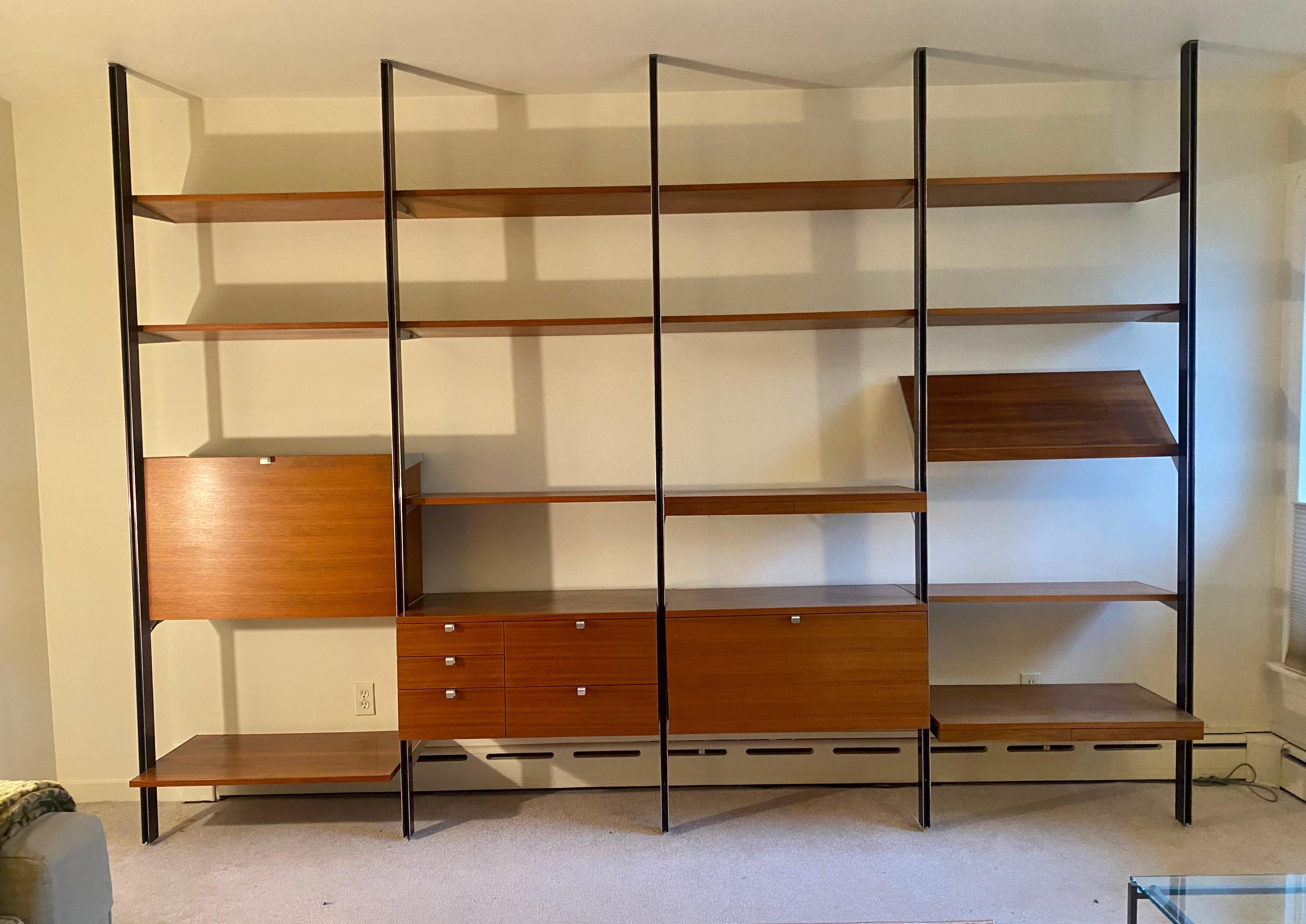 Outstanding and Early George Nelson C S S (comprehensive storage system) ,,manufactured by Herman Miller..4 bAYS consisting of 10 Shelves,,1 tilting book holder....Drop Down Desk with drawers and cubbies,5 drawer cabinet,Pull out turntable cabinet