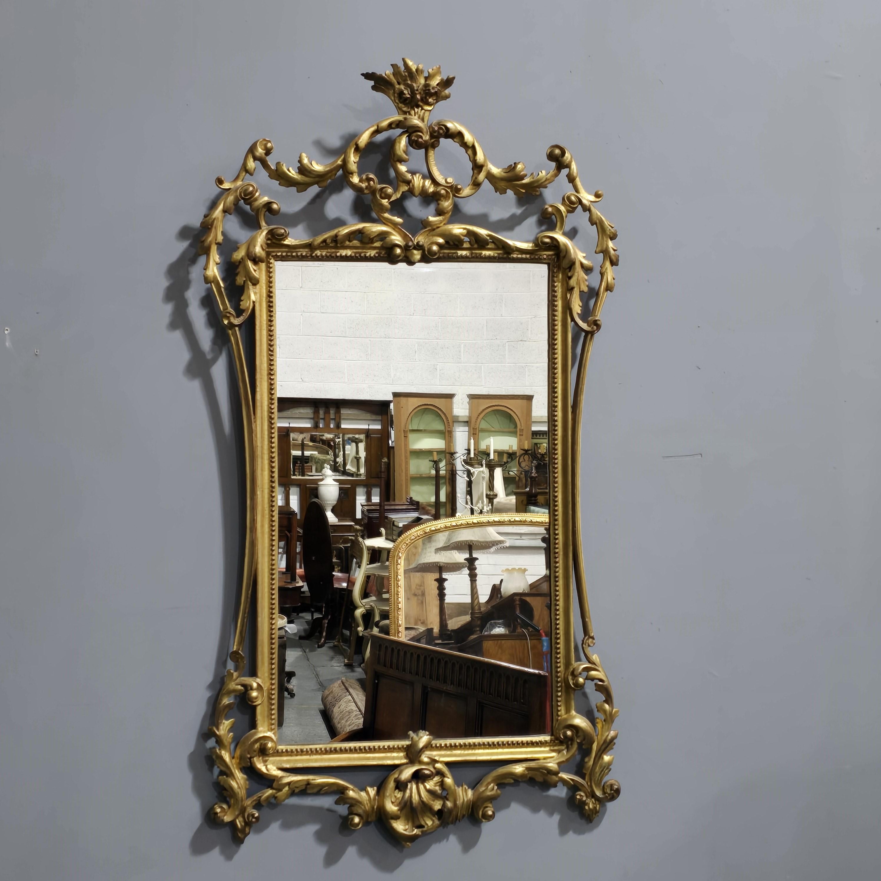 A  superb quality English gilt wall mirror, with original plate glass and back, excellent original condition.

38