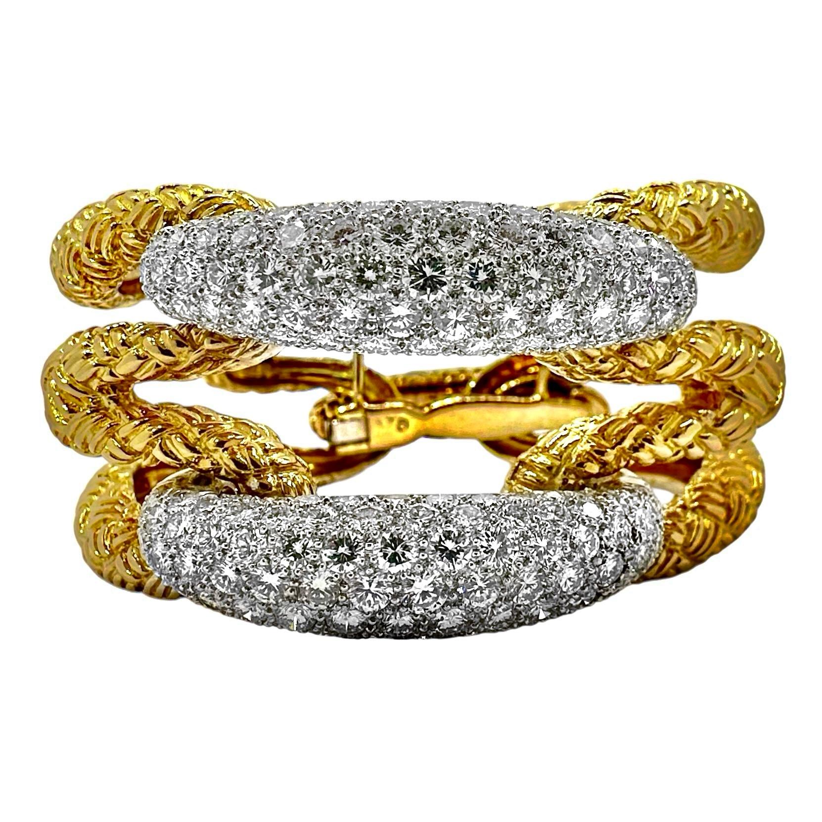 This wonderful and imaginative Mid-20th Century 18k yellow and diamond French cocktail bracelet has beauty, style, high quality and scale. It is meticulously crafted using the very finest goldsmithing techniques and  high quality brilliant cut