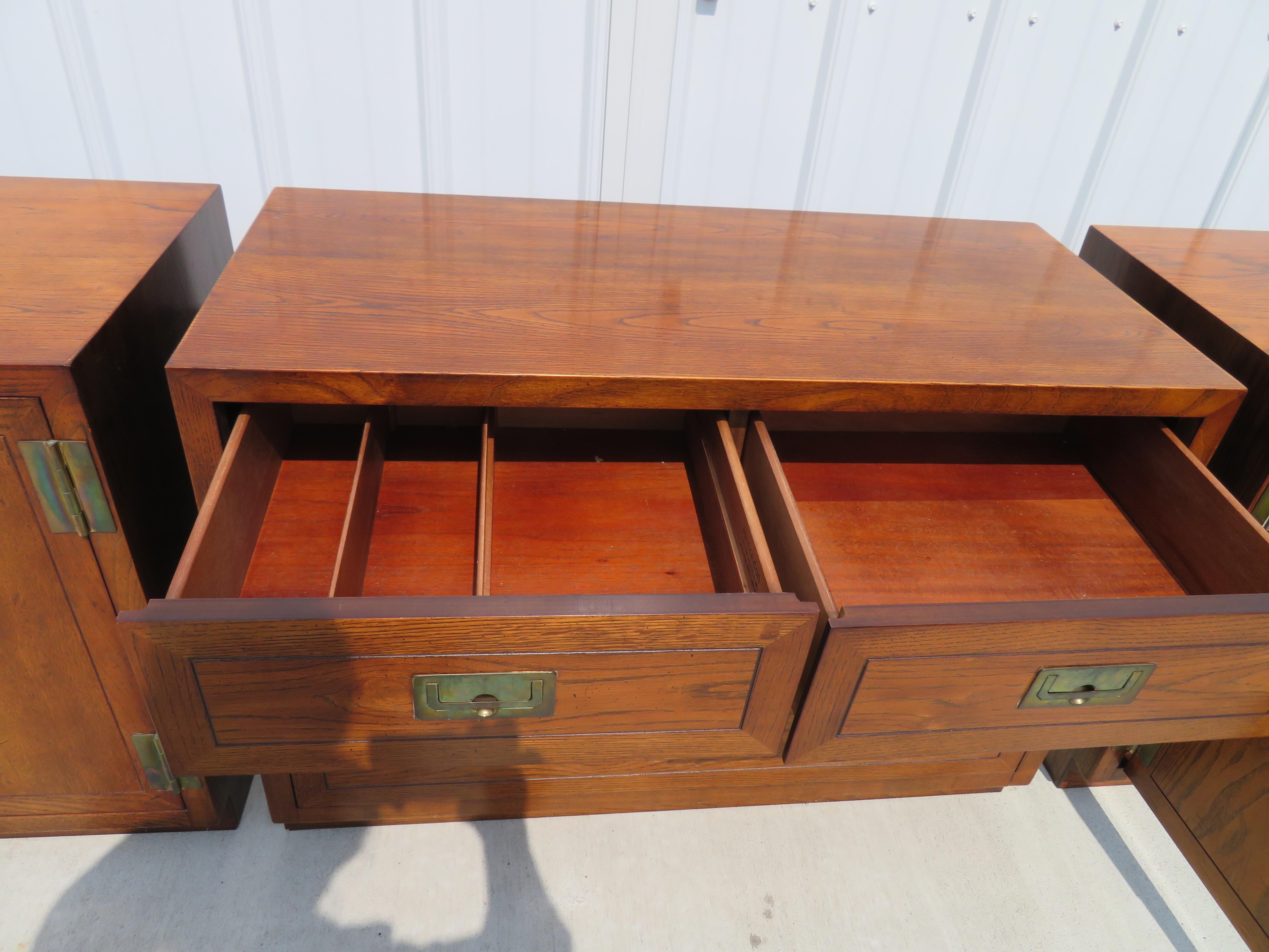 Outstanding Henredon Campaign chests forming a long low credenza. I love all three used together as shown but can also be used as bedside bachelor chests or even as end tables. The two-door chests measure 28
