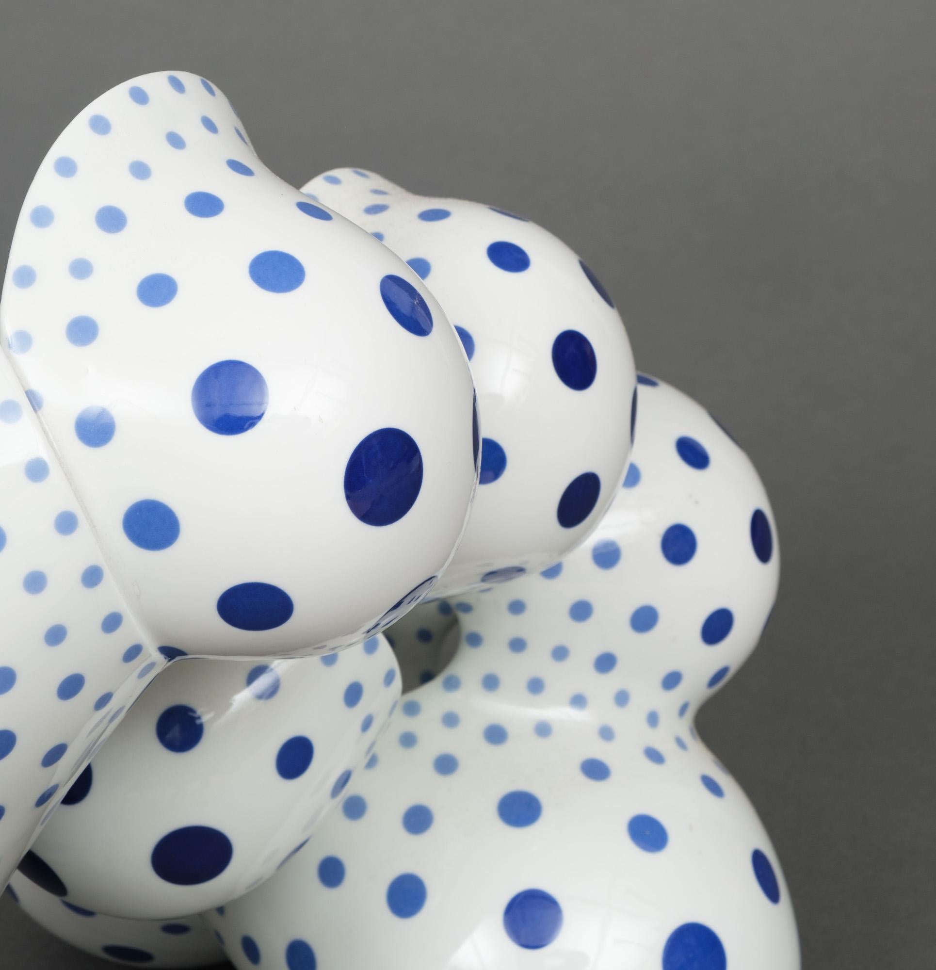 Outstanding and large porcelain biomorphic abstract sculpture covered in clear glaze and regularly distributed opulent cobalt blue polka dots of varying sizes, titled ‘Twisting Back, Multiplying’, hand-built by the highly praised Japanese ceramic
