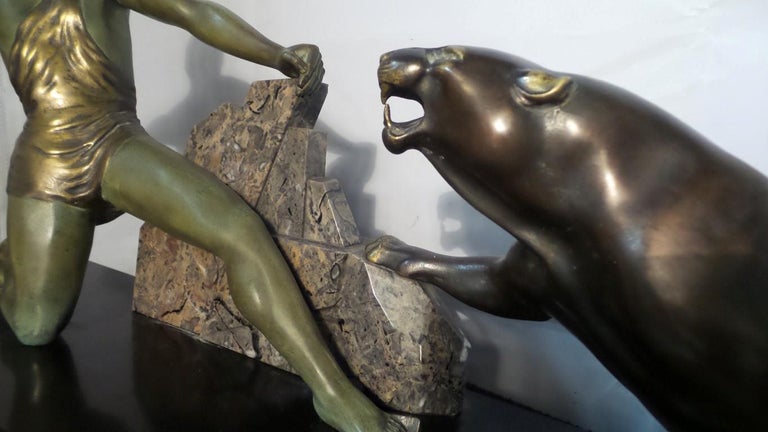 An outstanding and very rare study of a bronze hunter and panther.

The study is set on a marble base then a wood plinth with a waterfall edge

The hunter is in a verdigris finish and the panther is patinated bronze

The study is full of