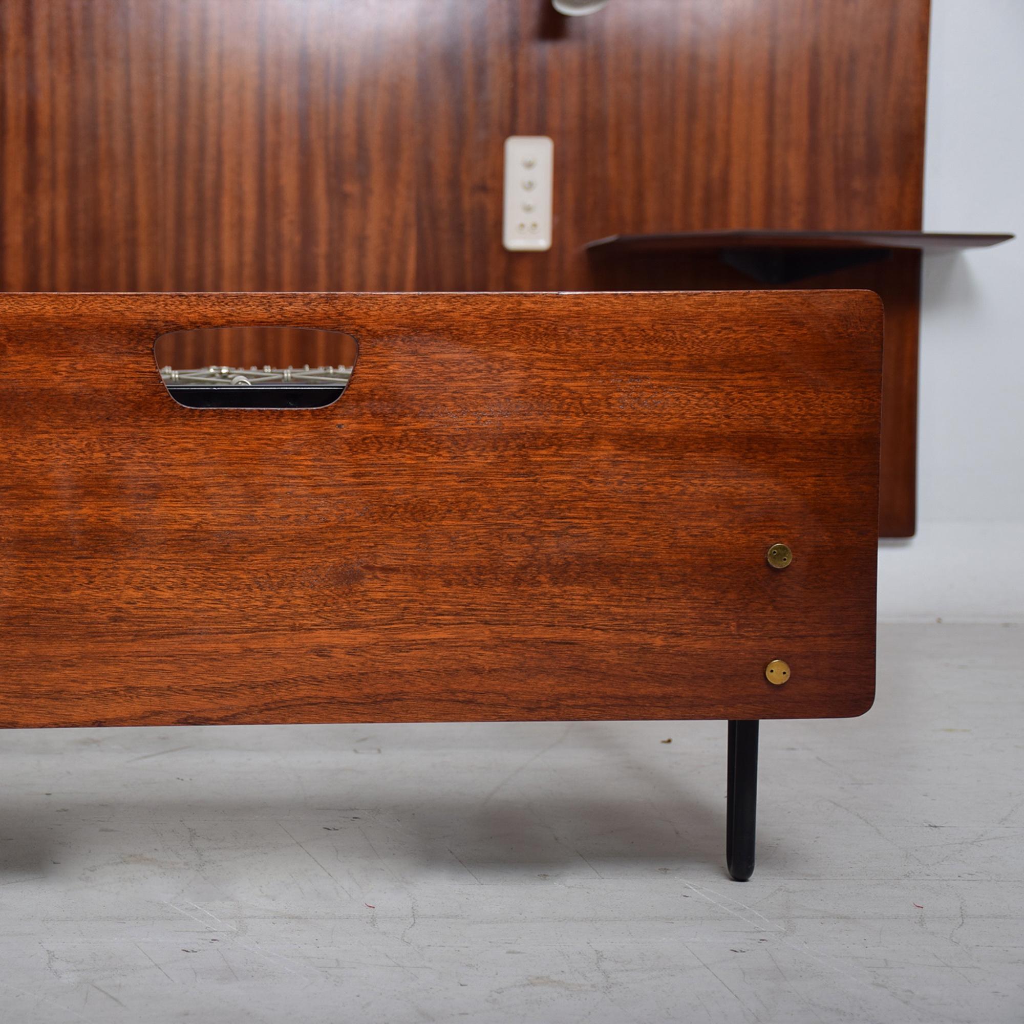 Custom Italian Bed 1950s Milan
Acquired from an apartment in Milan designed by Osvaldo Borsani
Headboard splits two sections attaches to wall.
Three on off buttons at side regulates lights.
Wood is Sapele Mahogany.
Each side has a built-in table;