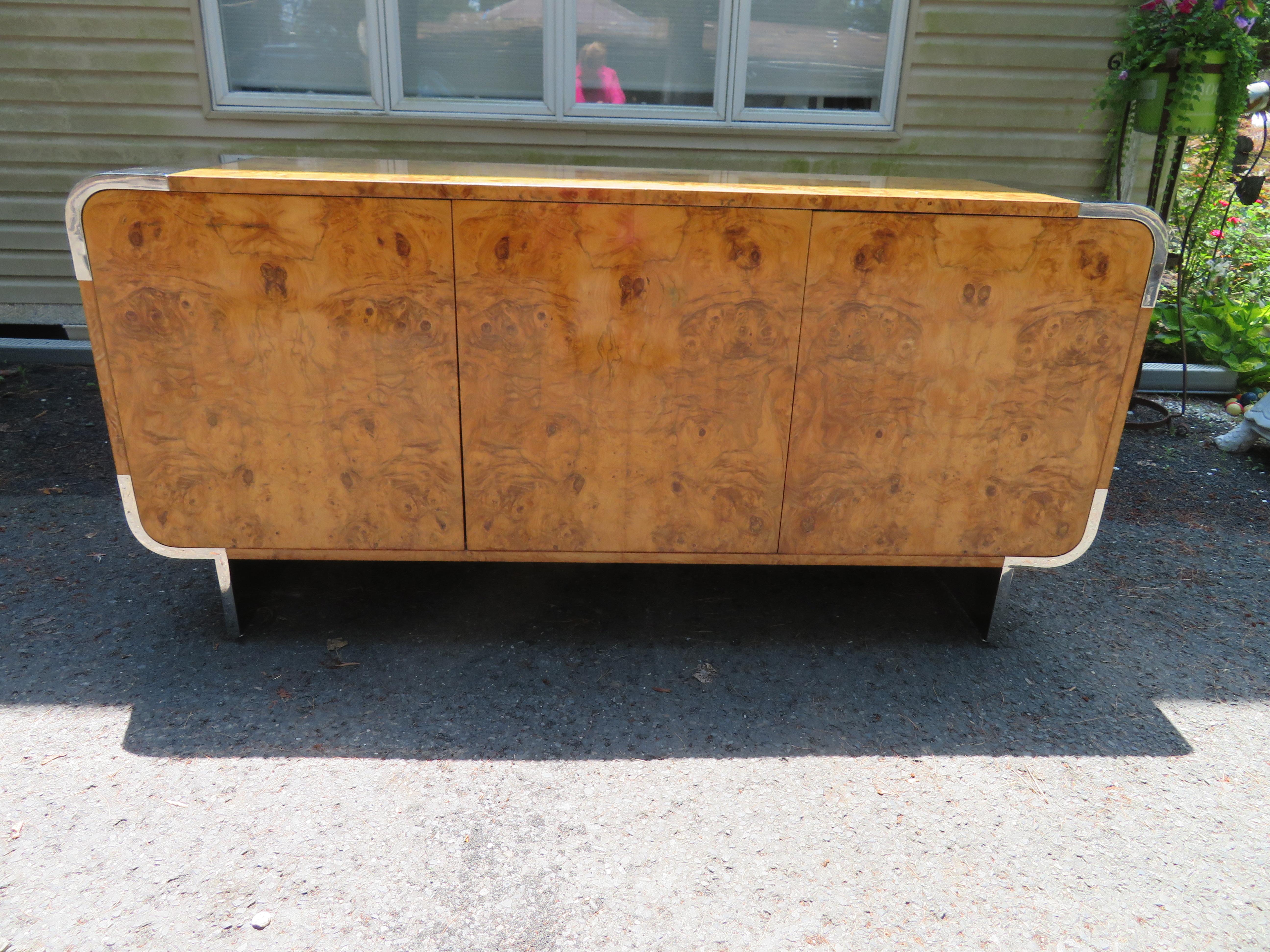 Outstanding Mid-Century Modern burl wood and chrome credenza designed by Leon Rosen, manufactured by Pace Collection. In wonderful original condition, heavy and sturdy, this piece is even finished with burl wood veneer on the backside-perfect to use