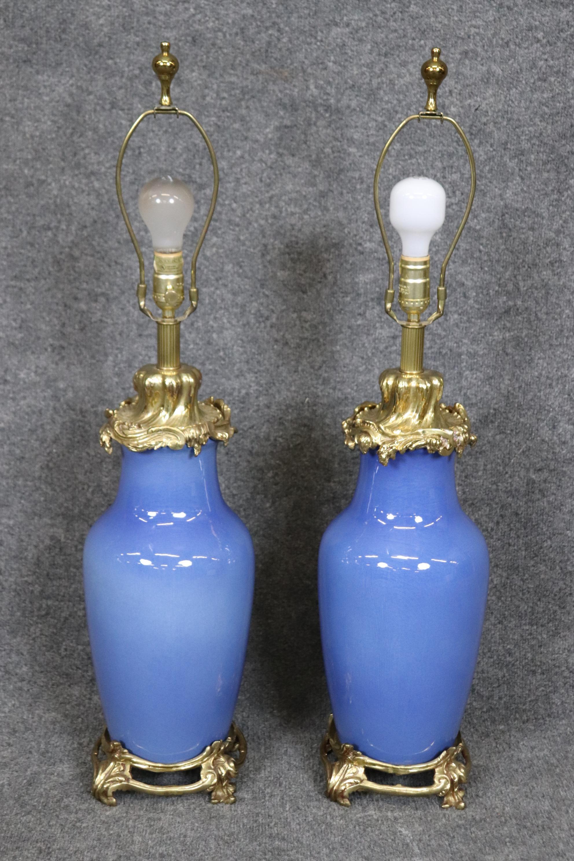 This is a gorgeous pair of extremely High Quality cobalt blue and solid bronze or heavy brass ormolu that's bright and in beautifully detailed. The table lamps are French and not old so they are in good used condition with minor signs of age and