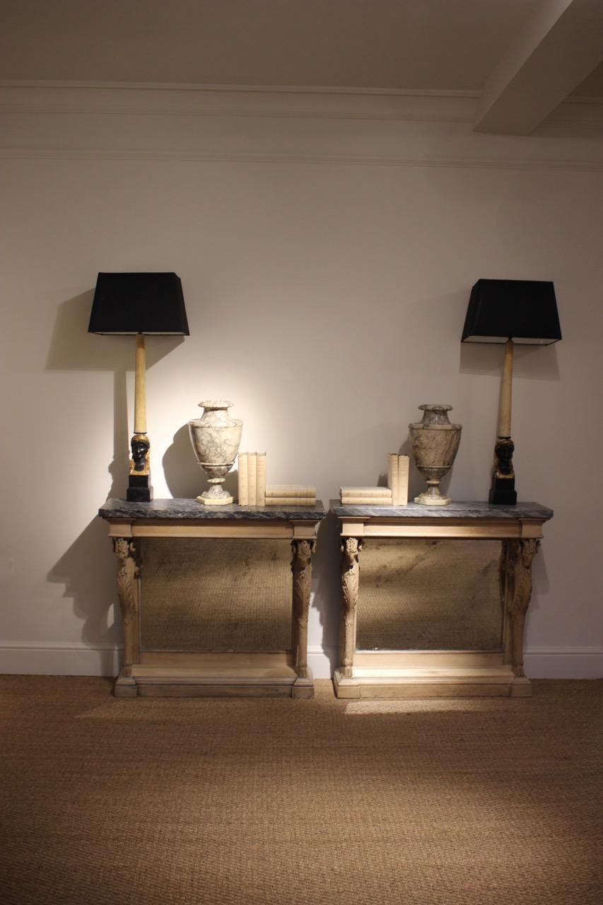 An outstanding pair of mid-19th century French console table in bleached oak, with later distressed mirror plates.
The consoles with great quality carving ram heads. Marble period but of later date.
This elegant and fine pair of console tables