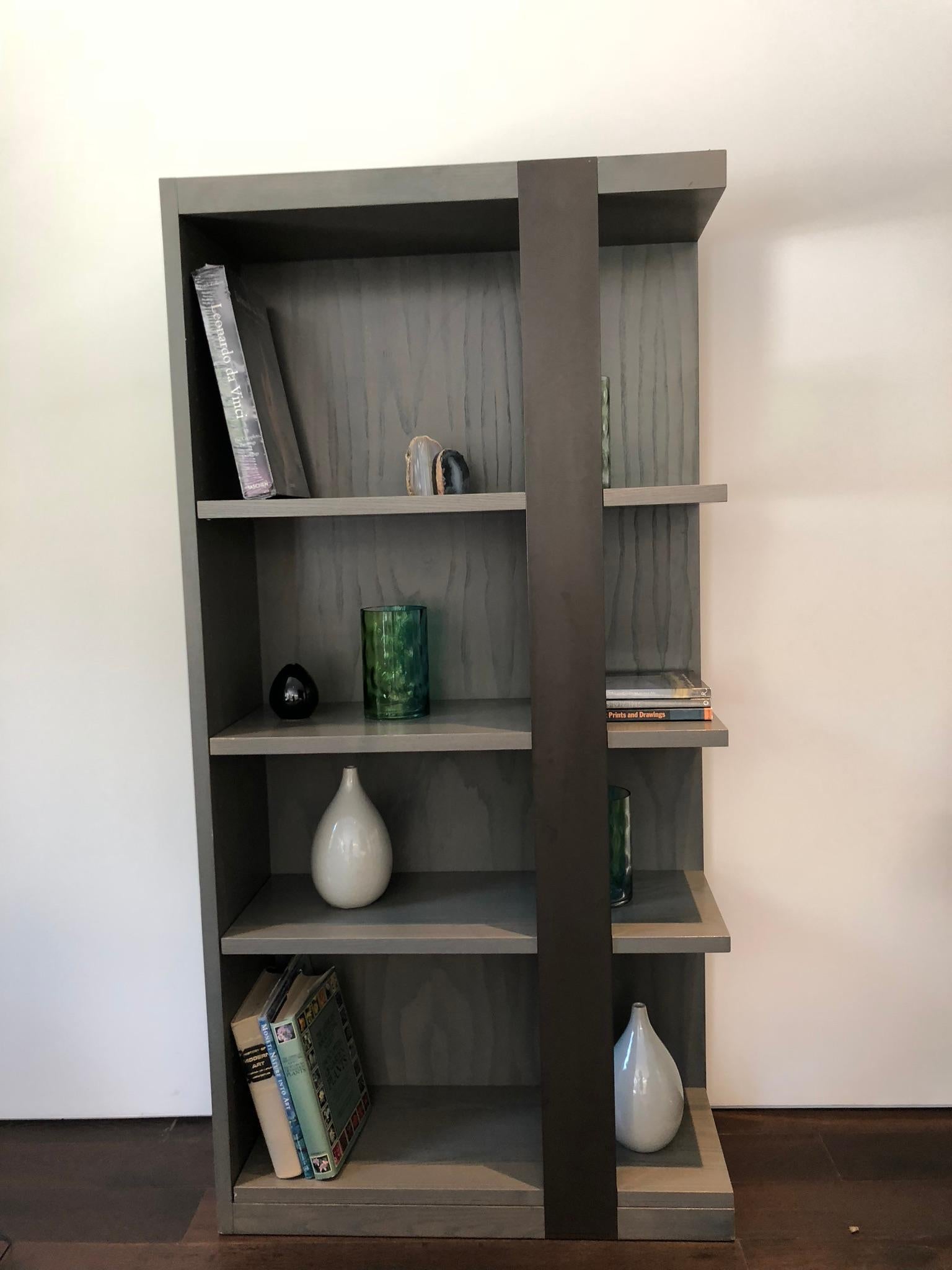 Stunning pair of bookcases or shelving units designed and manufactured by Antoine Proulx in 1997.
Each piece comes with 3 adjustable shelves, they are solidly built out of oak wood and stained in a gray-wash finish.
Both pieces are in excellent