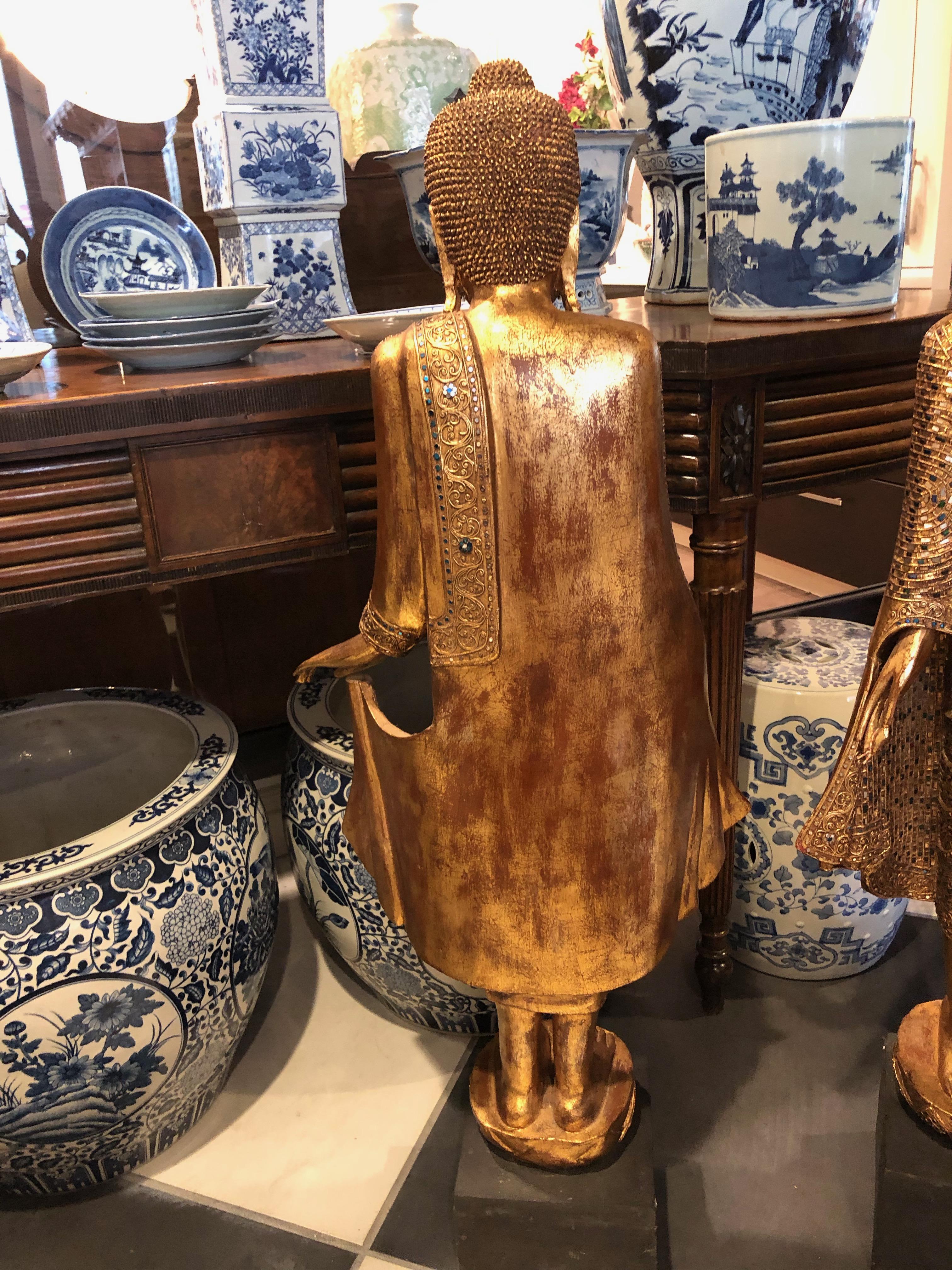 Fruitwood Pair of Gold Leafed Standing Thai Buddhas Statues