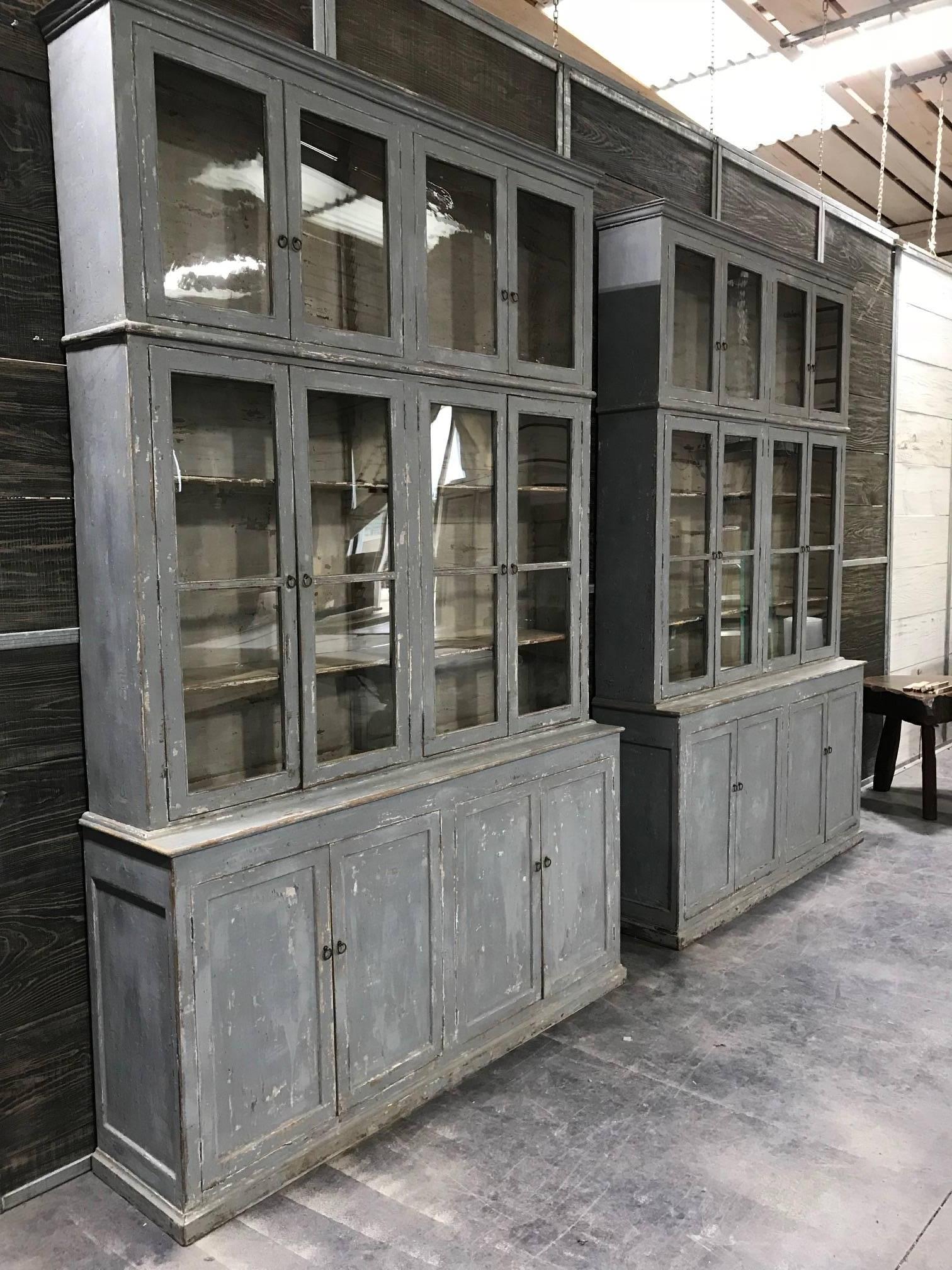 An outstanding and monumental pair of early 19th century bookcases from the Catalan region of Spain. Wonderfully constructed of painted wood and glass, each bookcase is in three sections. These bookcases will add style and elegance to any interior.