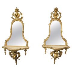Exceptionnelle paire de miroirs Girondelle Regency