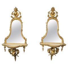 Exceptionnelle paire de miroirs Girondelle Regency