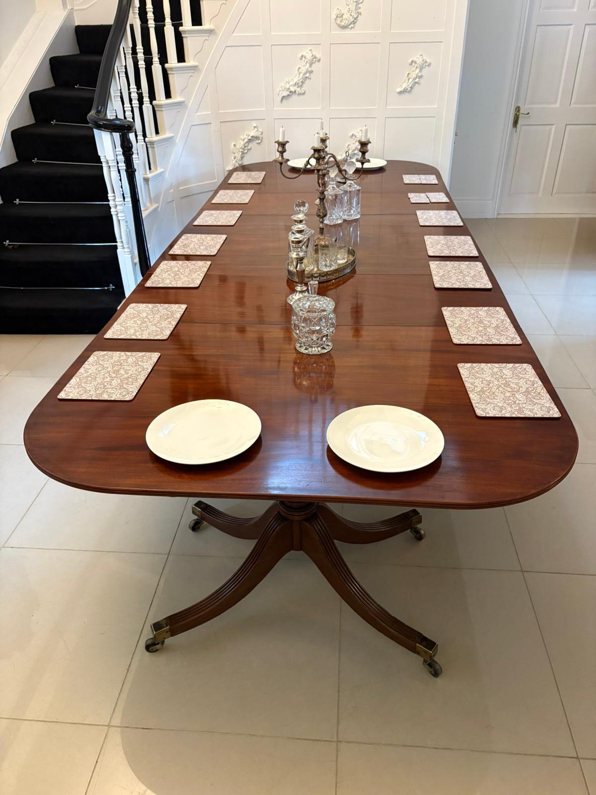 Outstanding quality antique regency 16/18 seater figured mahogany 3 pilar dining table having a magnificent quality figured mahogany reeded edge top with 2 original extra leaves supported on fabulous turned pedestal columns standing on 4 splayed