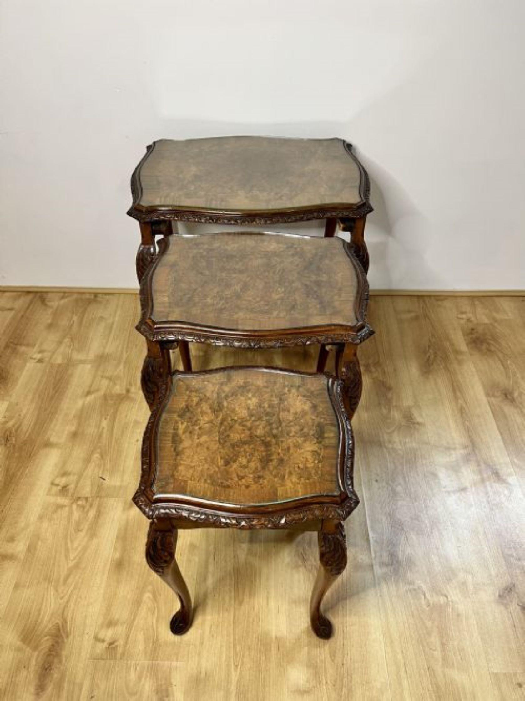Outstanding quality antique burr walnut nest of three tables having outstanding quality burr walnut serpentine shaped tops with a carved edge, standing on carved solid walnut shaped cabriole legs with carved scroll feet. 
Beautifully crafted and