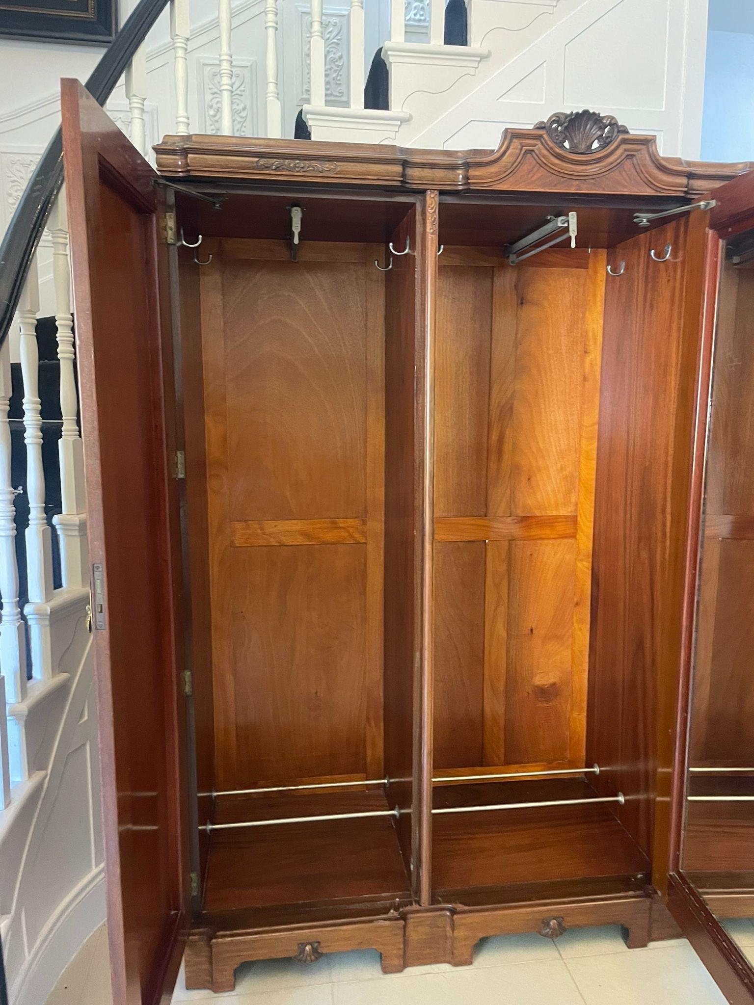 Outstanding quality antique carved burr walnut 3 door wardrobe having a marvellous quality shaped carved walnut cornice above three outstanding quality burr walnut doors with original ornate brass handles opening to reveal a fitted interior, mirror,